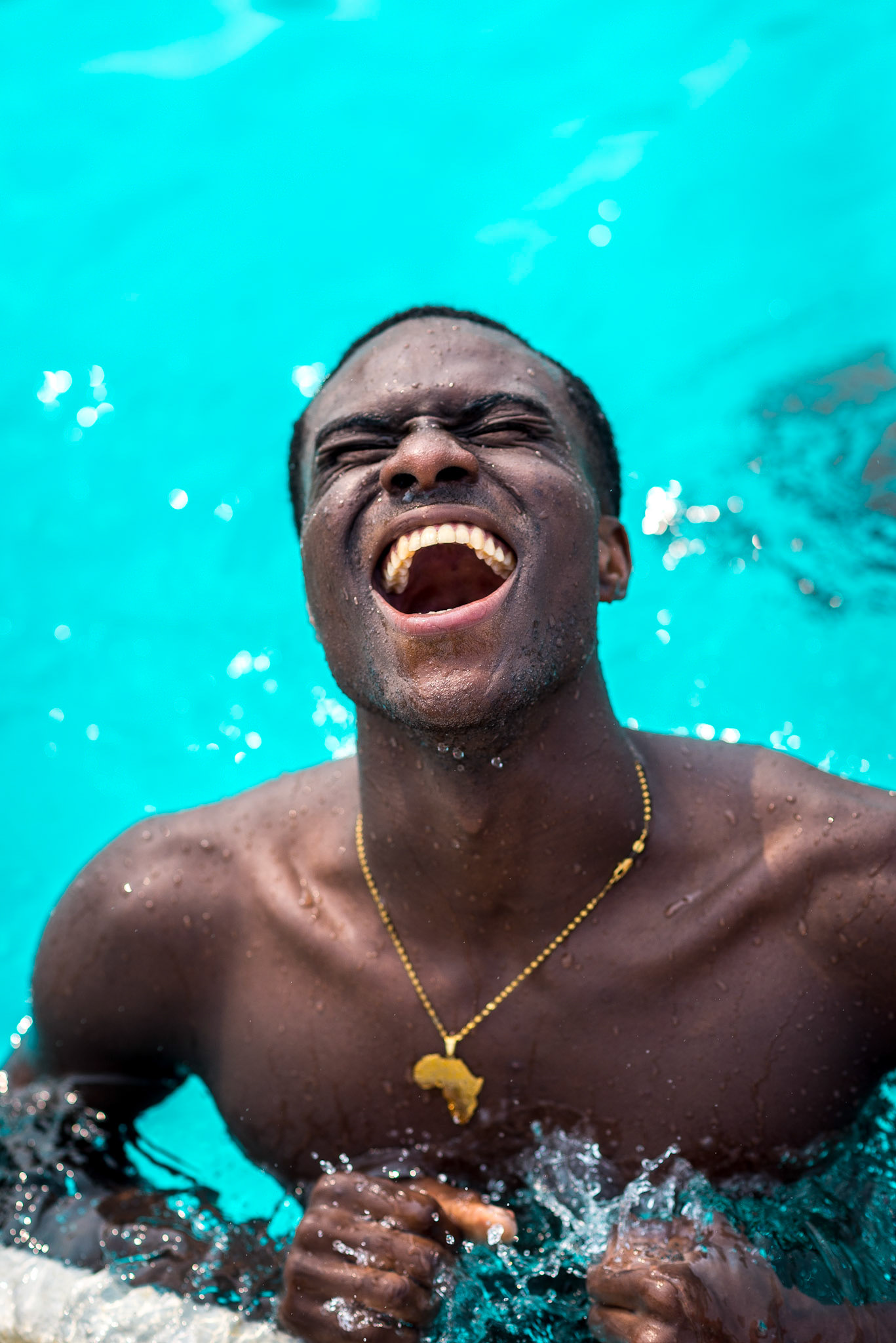 Group leader Chuck celebrates passing his swim test after many weeks of practice and lessons with campers.