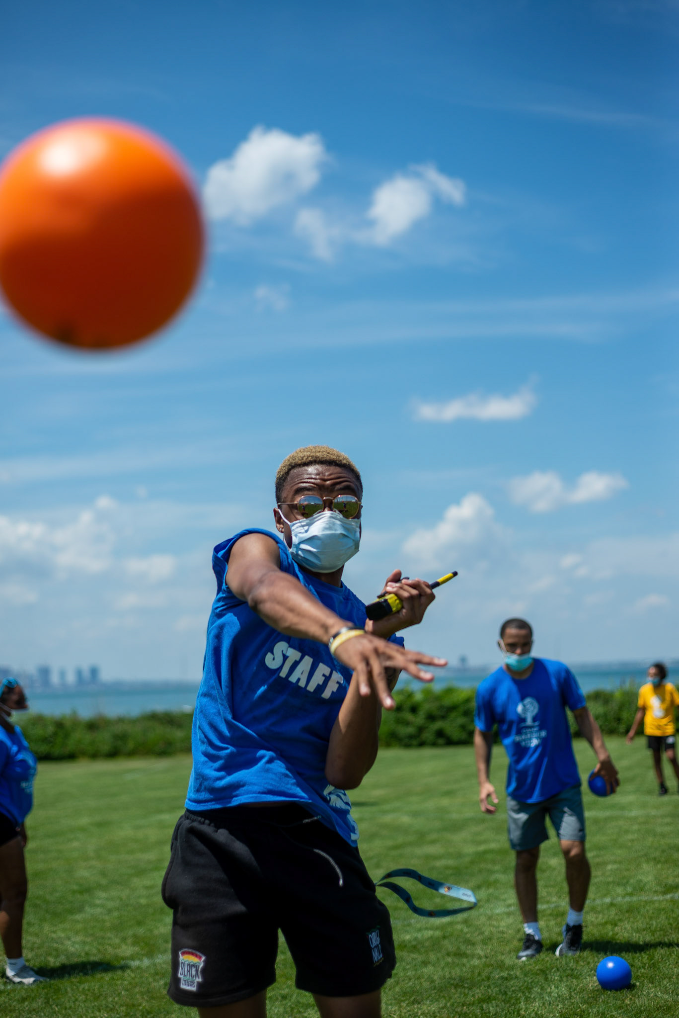 Team leader Jakai participates in a game of dodgeball on the first day of Camp Harbor View's 2021 season.