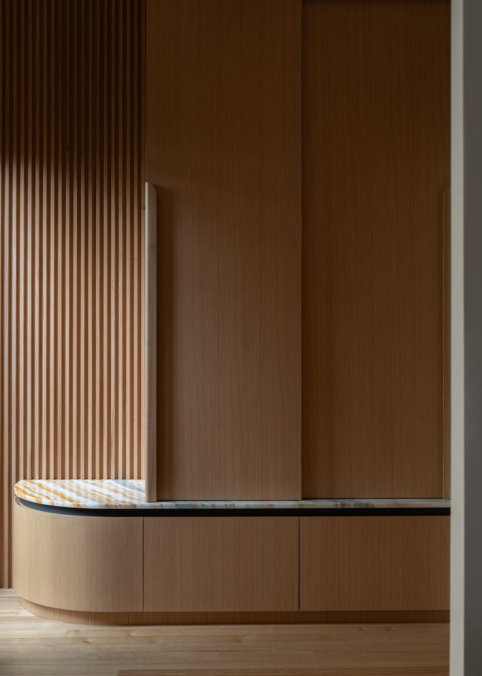 Oak cabinet with stone bench top