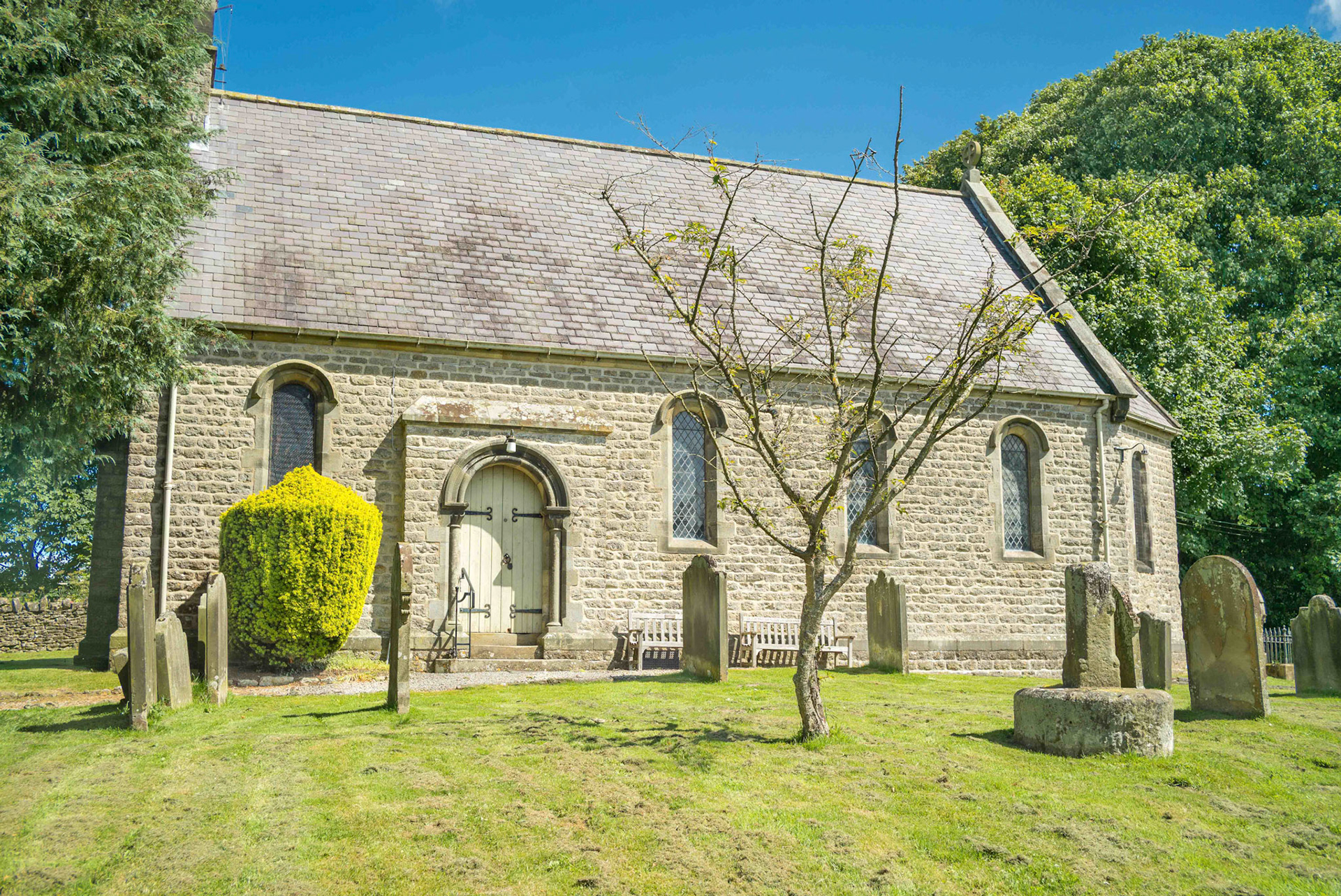 Cropton Cross Showing South and East Face and the Church - St Gregory's Church North Yorkshire UK 2024