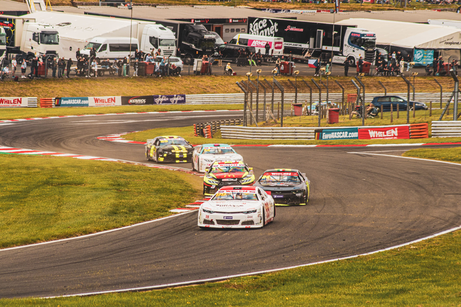 Cars racing through dirt