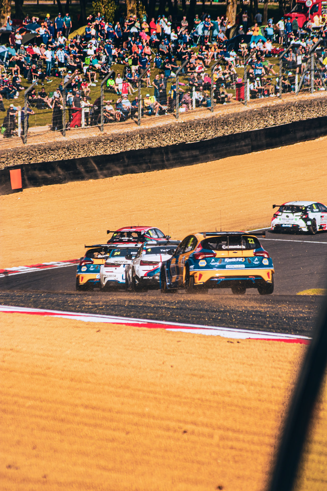 Multiple cars fighting coming onto Brabham