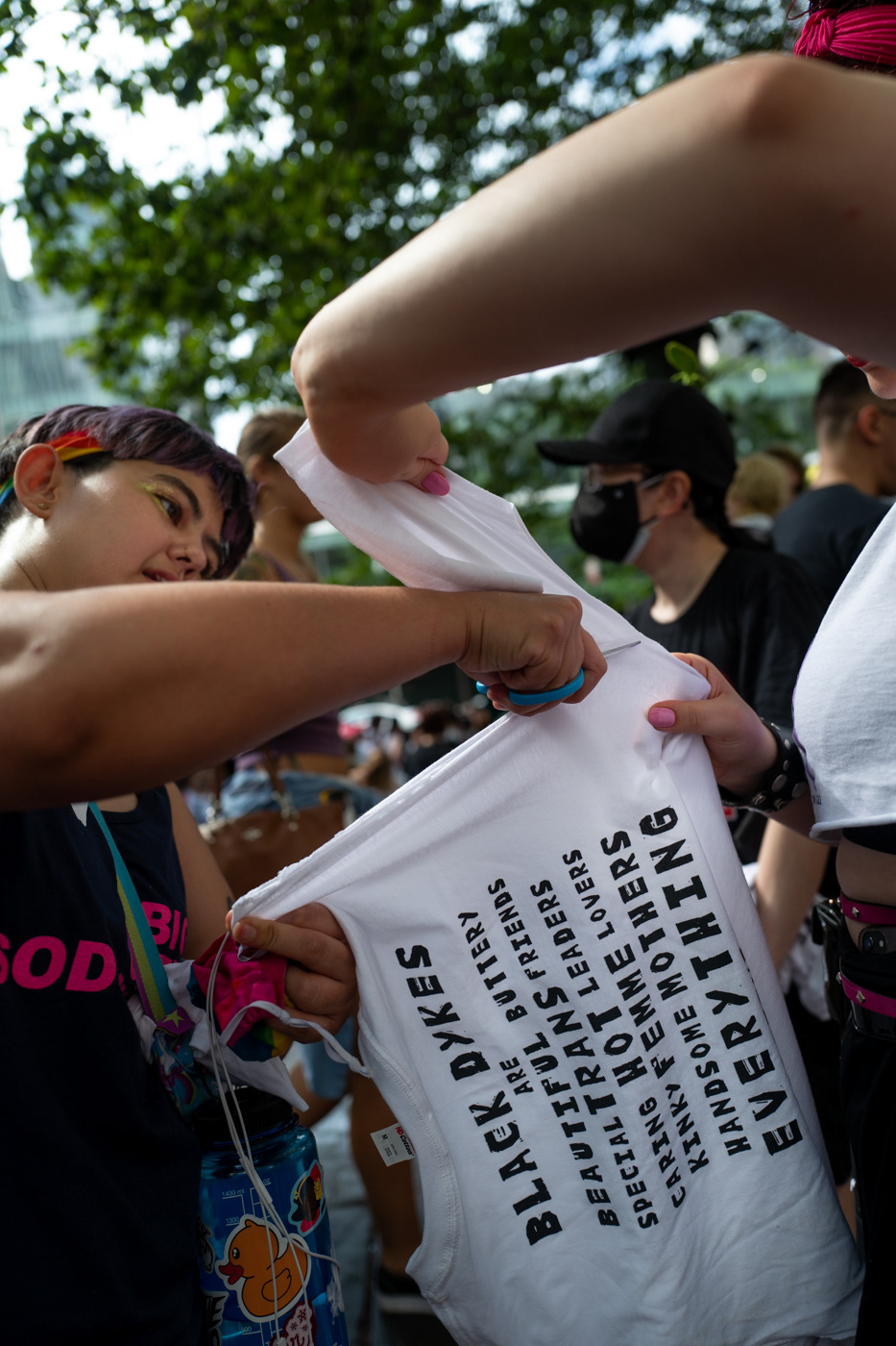 Saturday, June 26th 2021. Bryant Park, NYC.Volunteer Dyke March Marshalls, customizing their official t-shirts.