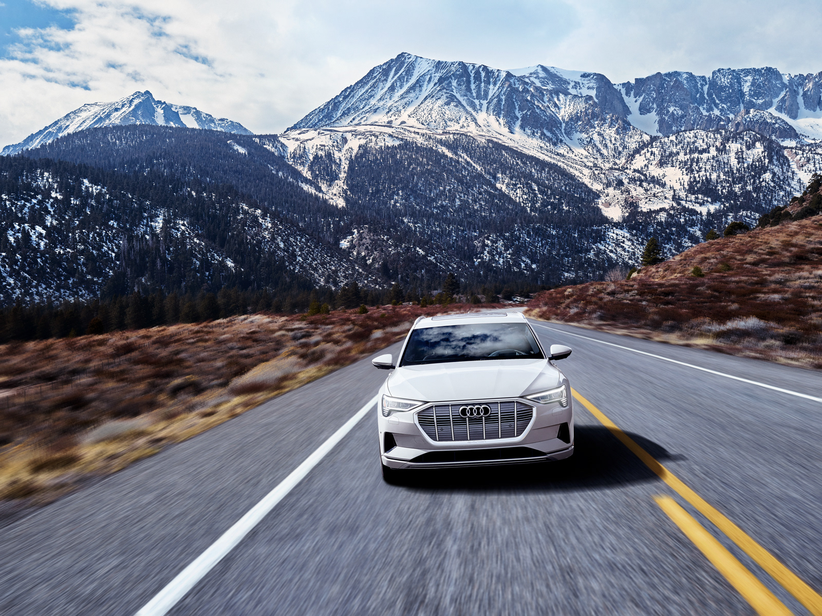 alt="Retouching and color grading for Audi e-tron campaign, showcasing the all-electric vehicle’s sleek design"