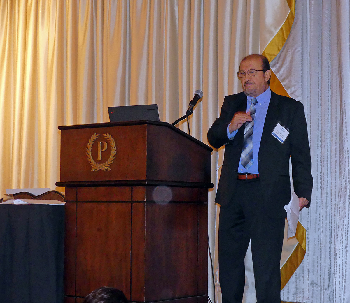Dr. Tarek Zaher (Indiana State University), co-founder of SMIFC, introducing the competition winners