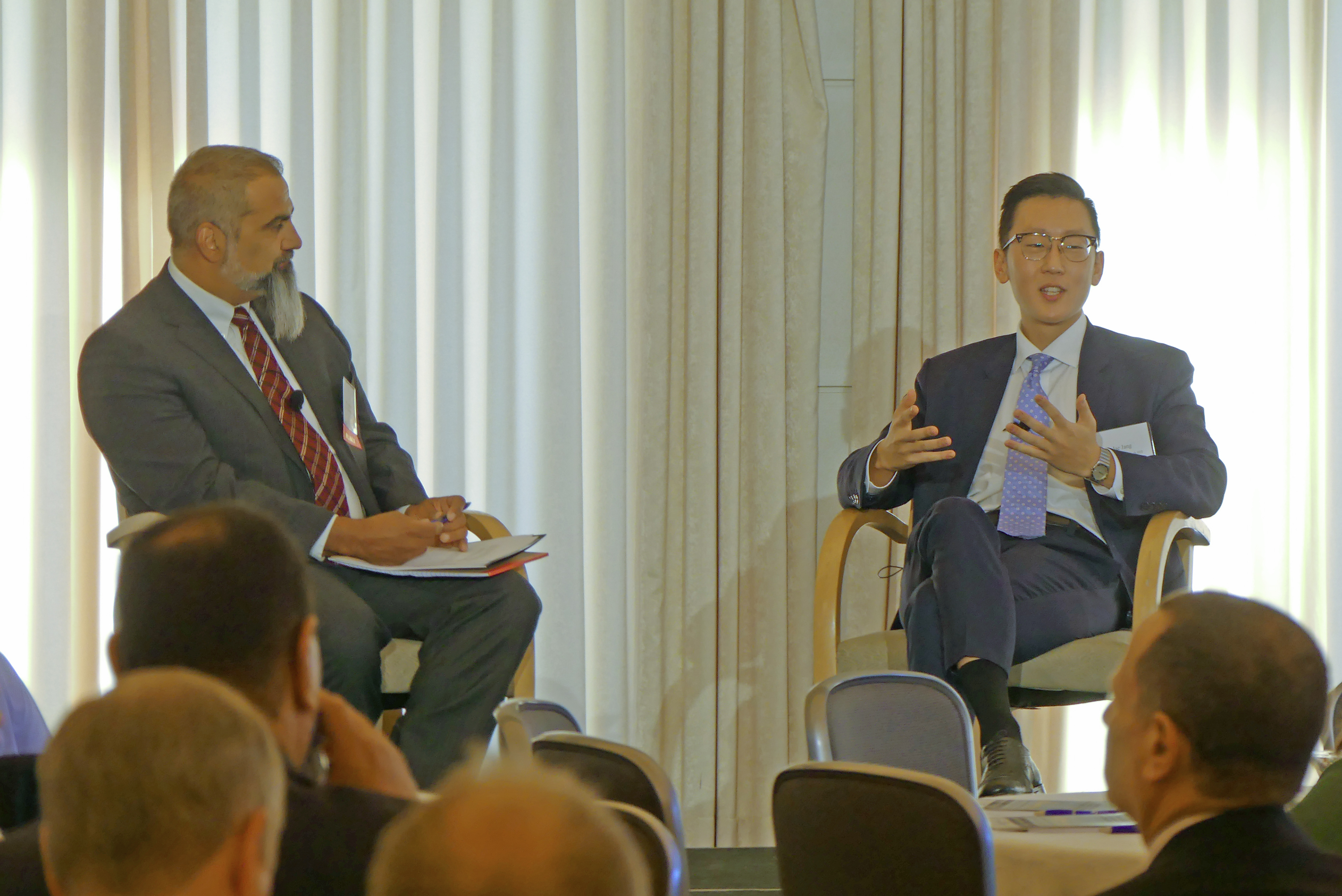 Josh Andrews, Senior Director, Faegre Drinker, talking to Jae Jang, policy advisor to The Honorable French Hill (R-AR)