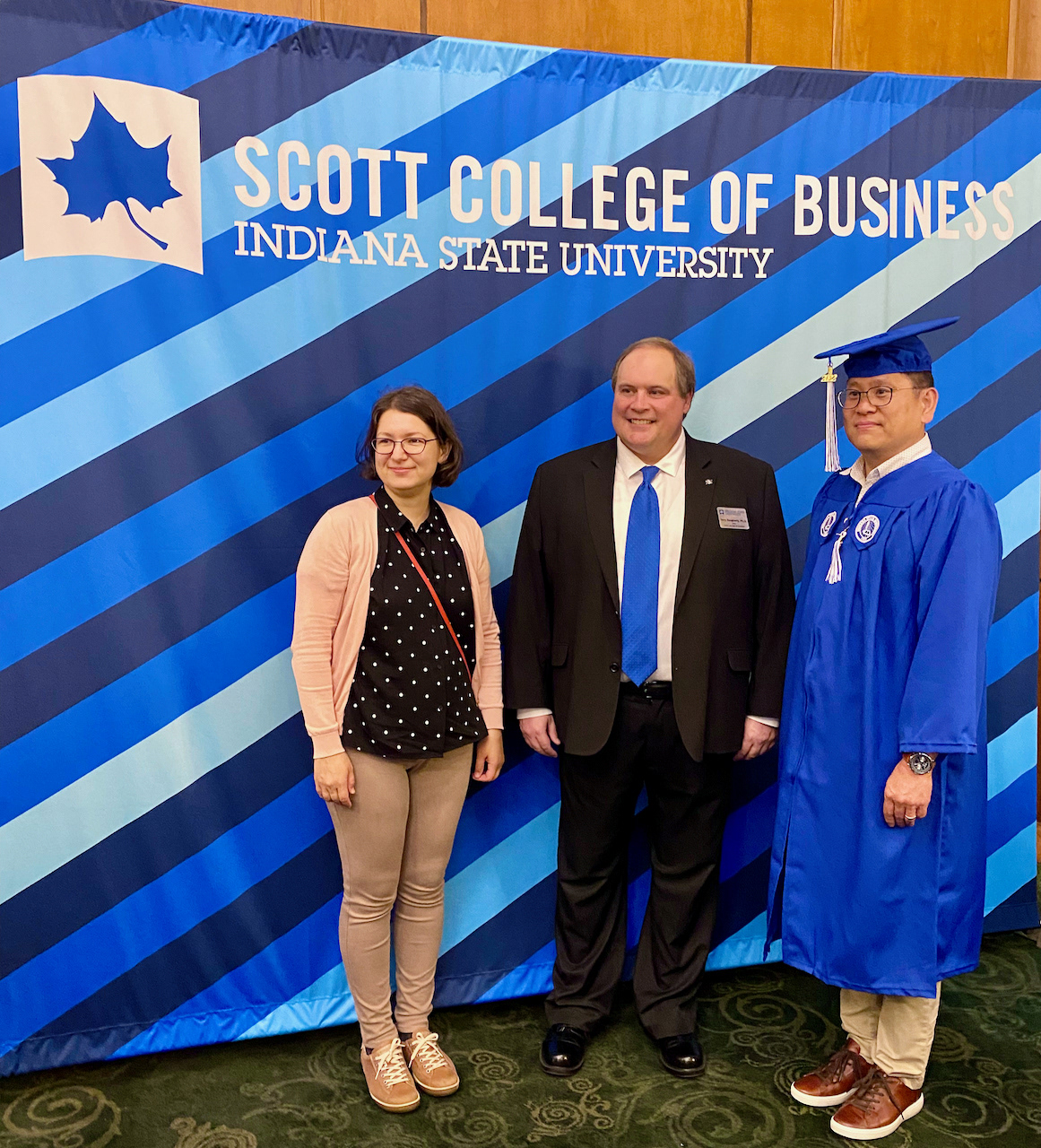 Woo Kim with his wife with dean Dr. Terry Daugherty