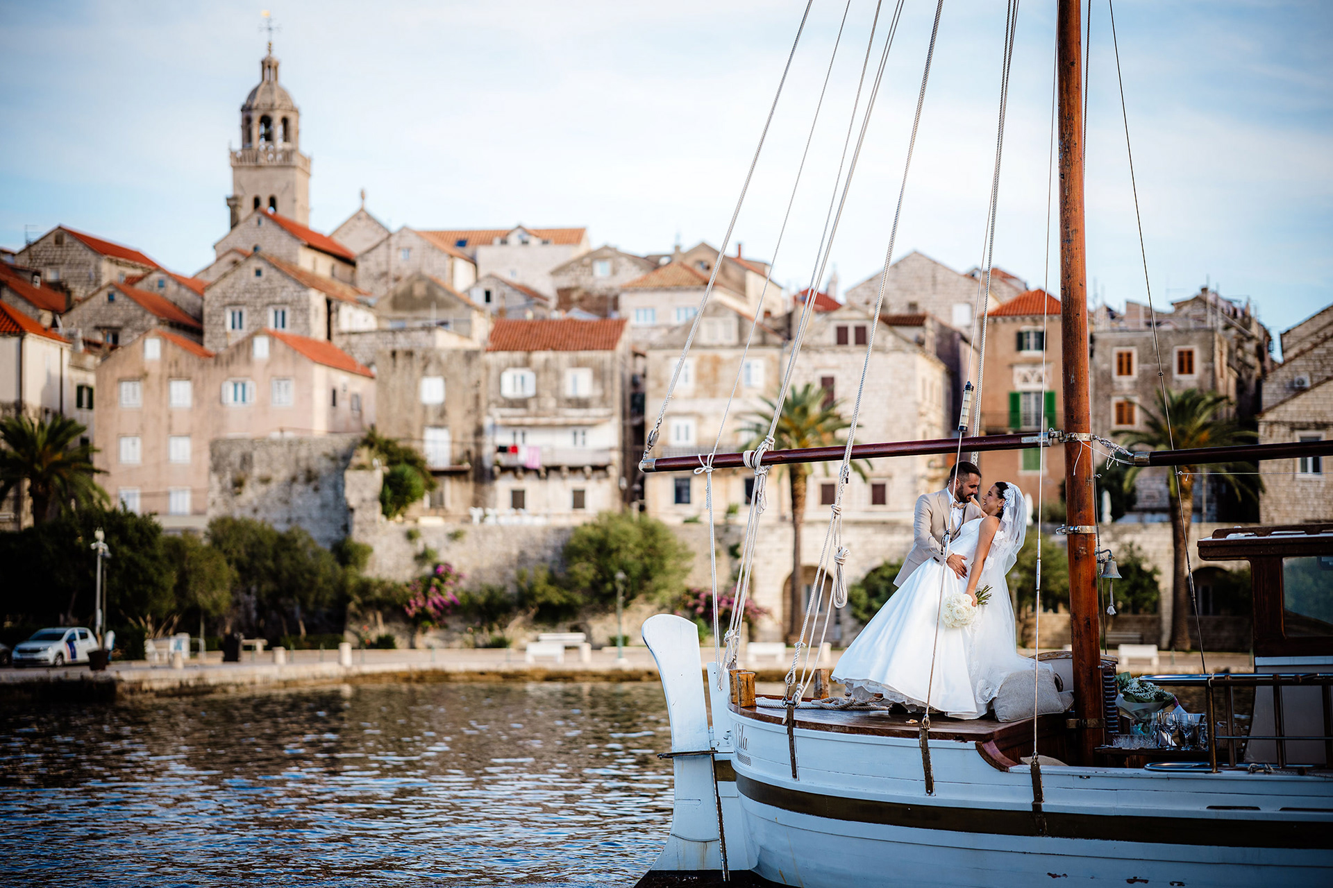 Wedding couple in Korčula old town with historic stone architecture in the background