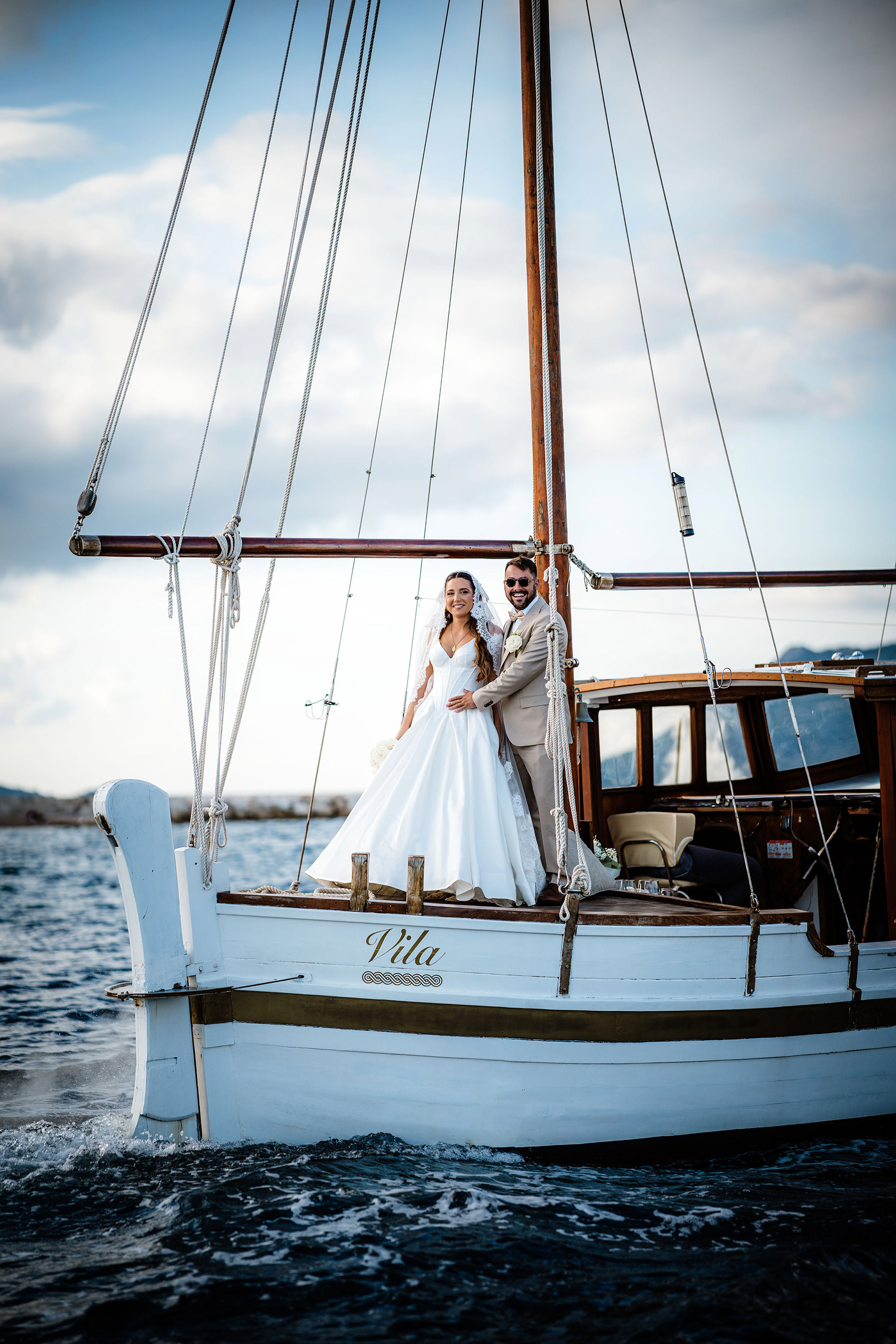 Bride and groom on boat at sunset in Korčula with Mediterranean sea view
