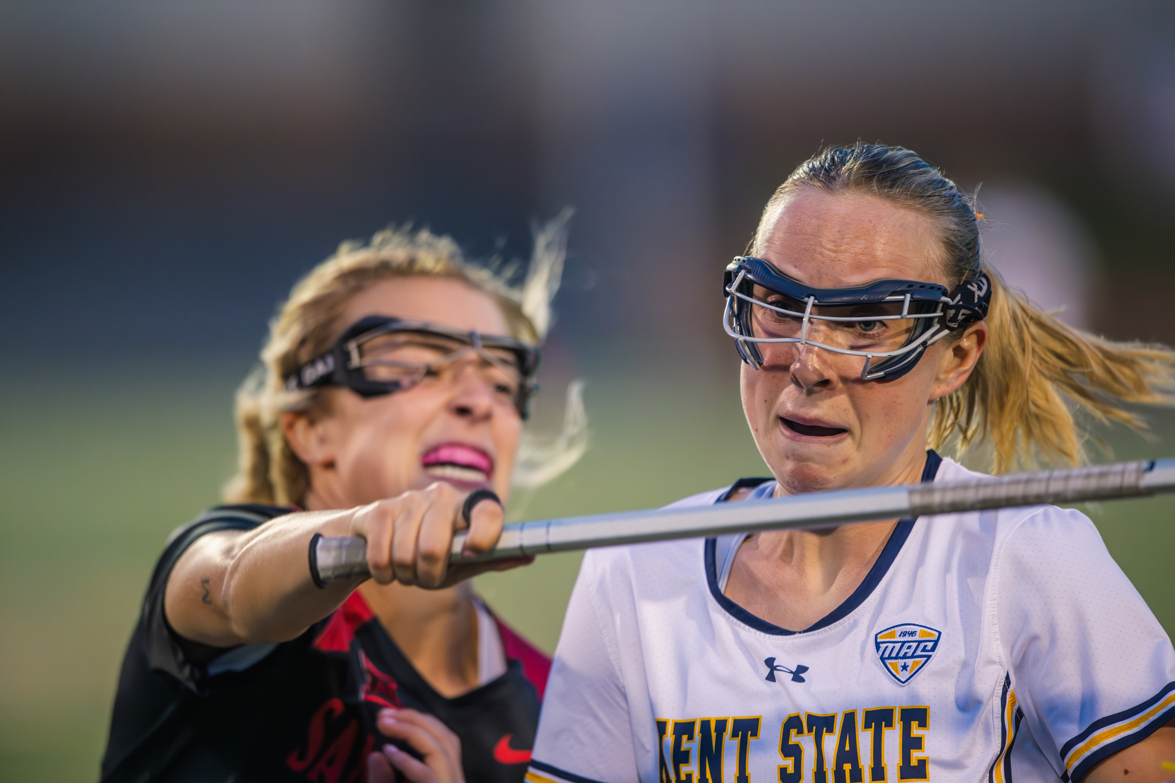 Inches apart and fighting for every advantage. A Kent State midfielder and an SDSU defender go face to face in the kind of physical contest that defines midfield battles.