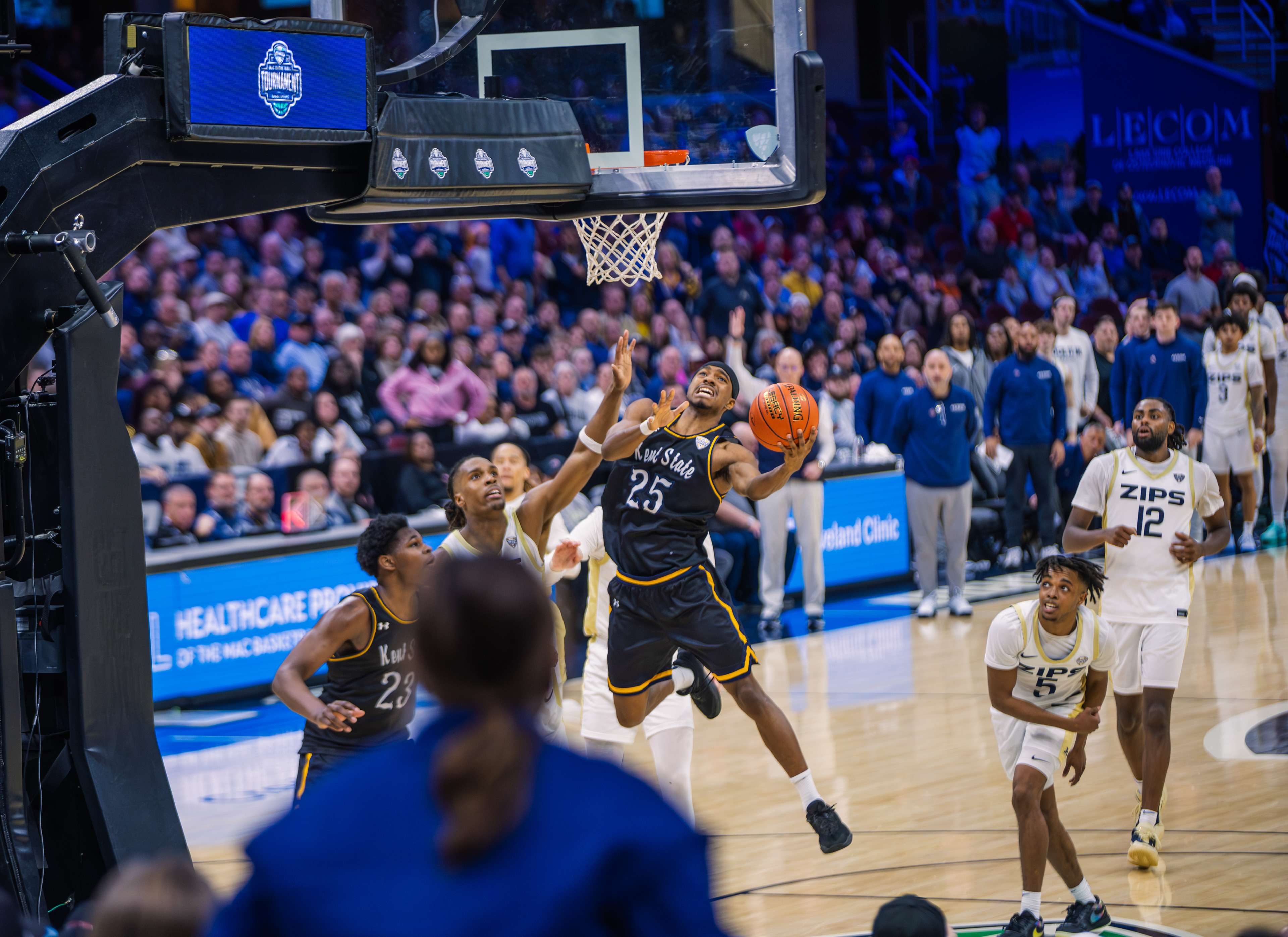 Kent State's Jahari Williamson drives beneath the backboard for a layup against Akron during the MAC Tournament semifinals at Rocket Mortgage FieldHouse, Cleveland.