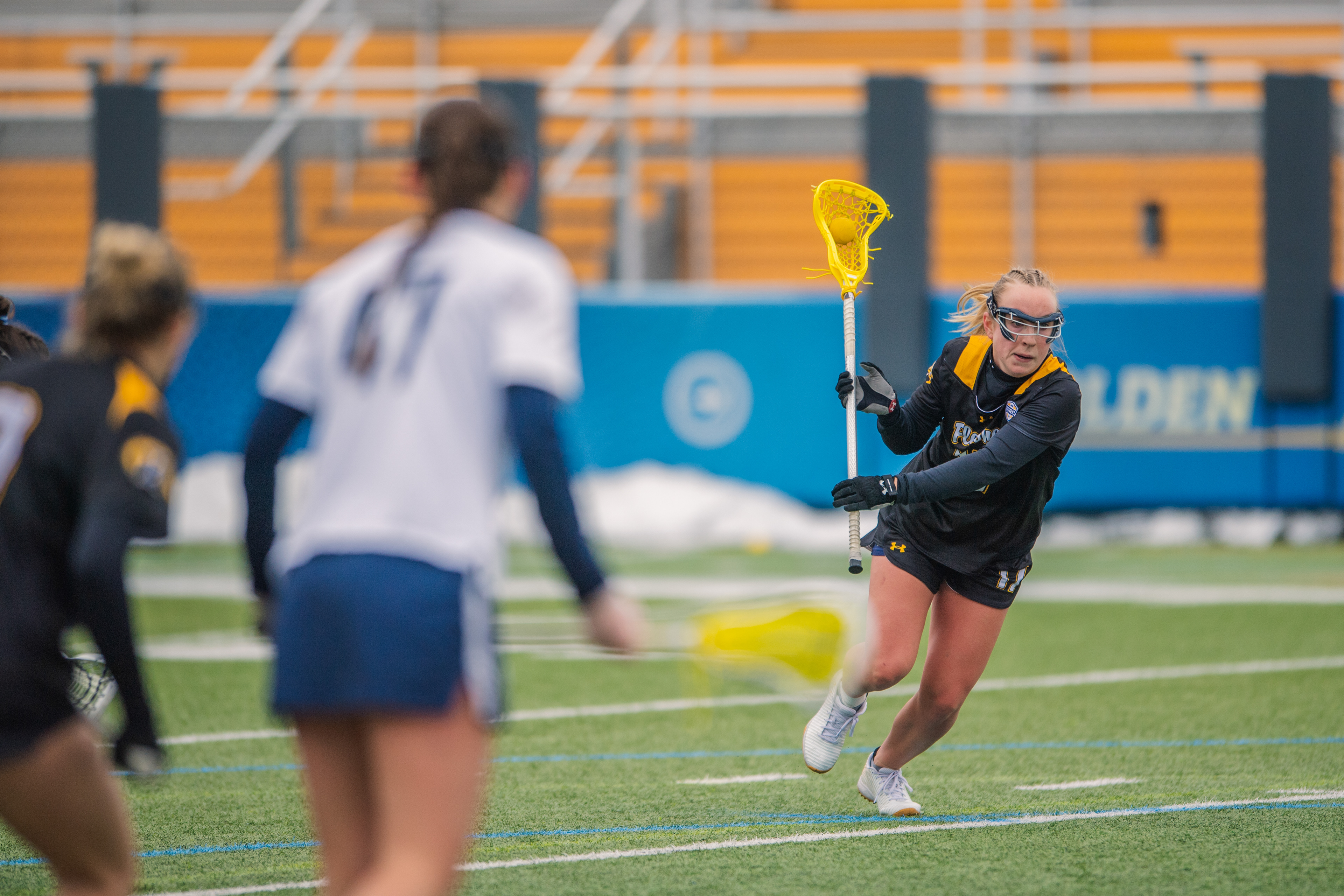 A Kent State midfielder surveys the field before releasing a pass against Butler. A moment of calm calculation in the middle of a fast-moving game.