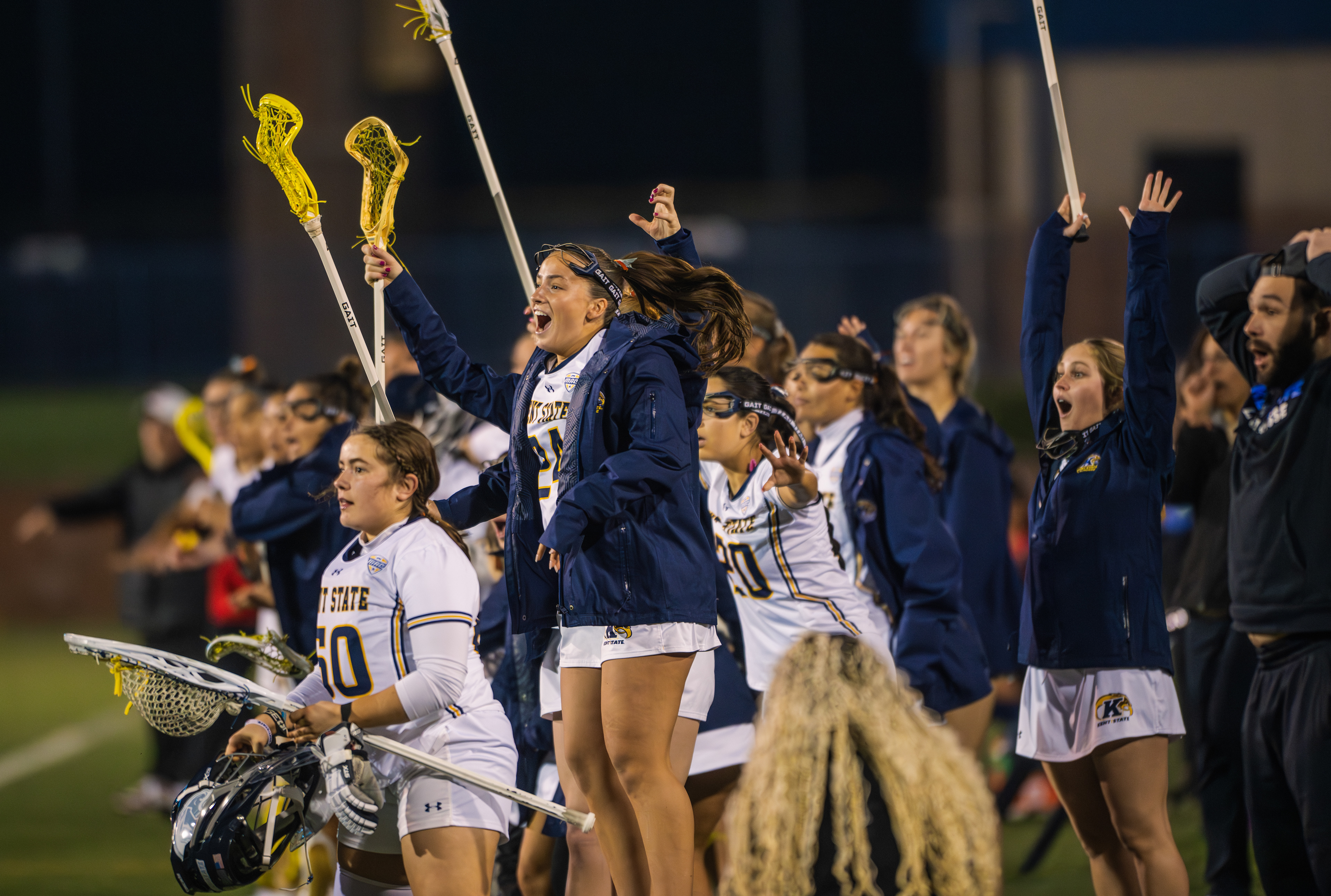 The Kent State sideline ignites with sticks raised and voices up as the Flashes pull away from SDSU under the lights at Dix Stadium.
