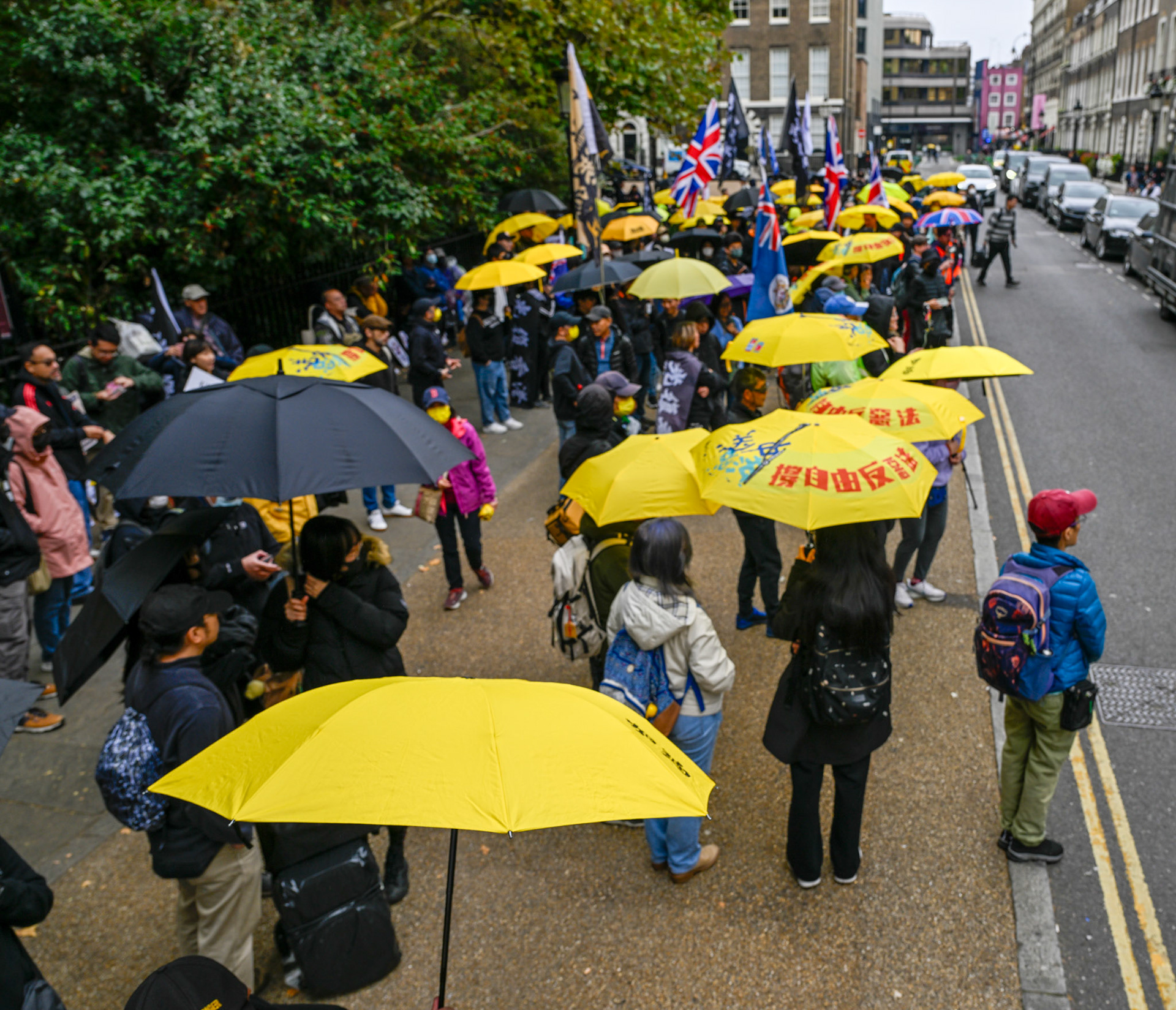 London, UK, 28th September 2025: 11th Anniversary march to commerate the pro democracy protest in Hong Kong in 2014 called the yellow umbrella revolution, monkeybutlerimages/ alamy live news