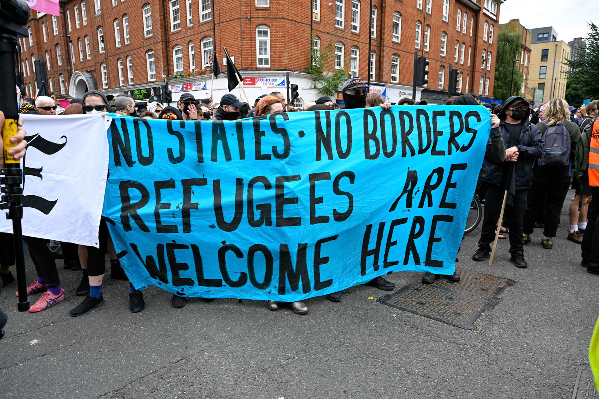 London, UK, 2nd August 2025, Protest outisde of the Thistle Hotel Barbican supporting migrant residents and challenging a counter protest