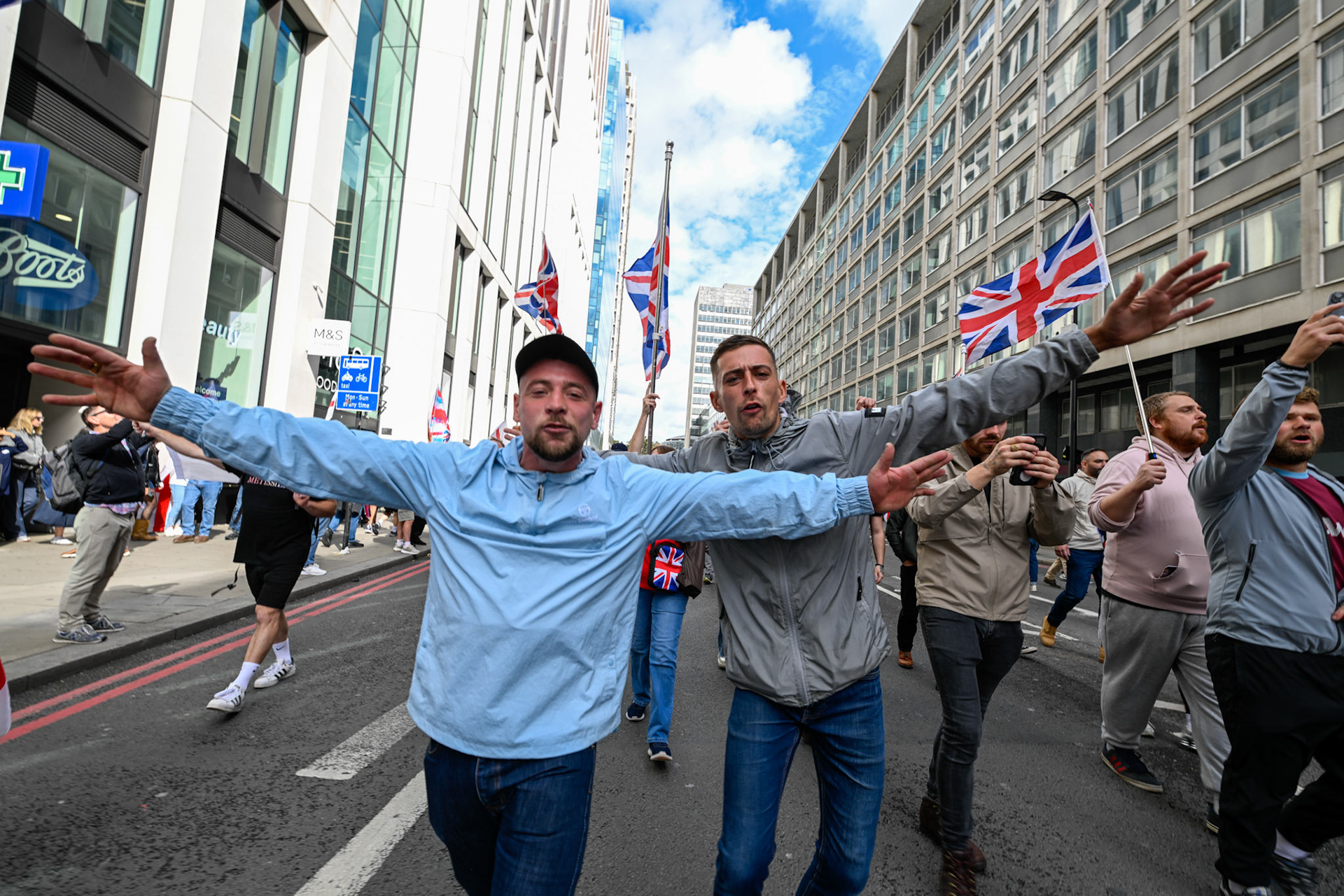 London, UK, 13th September: Approximately 100,000 supporters of Tommy Robinson march through central London,  monkeybutlerimages/alamy live news