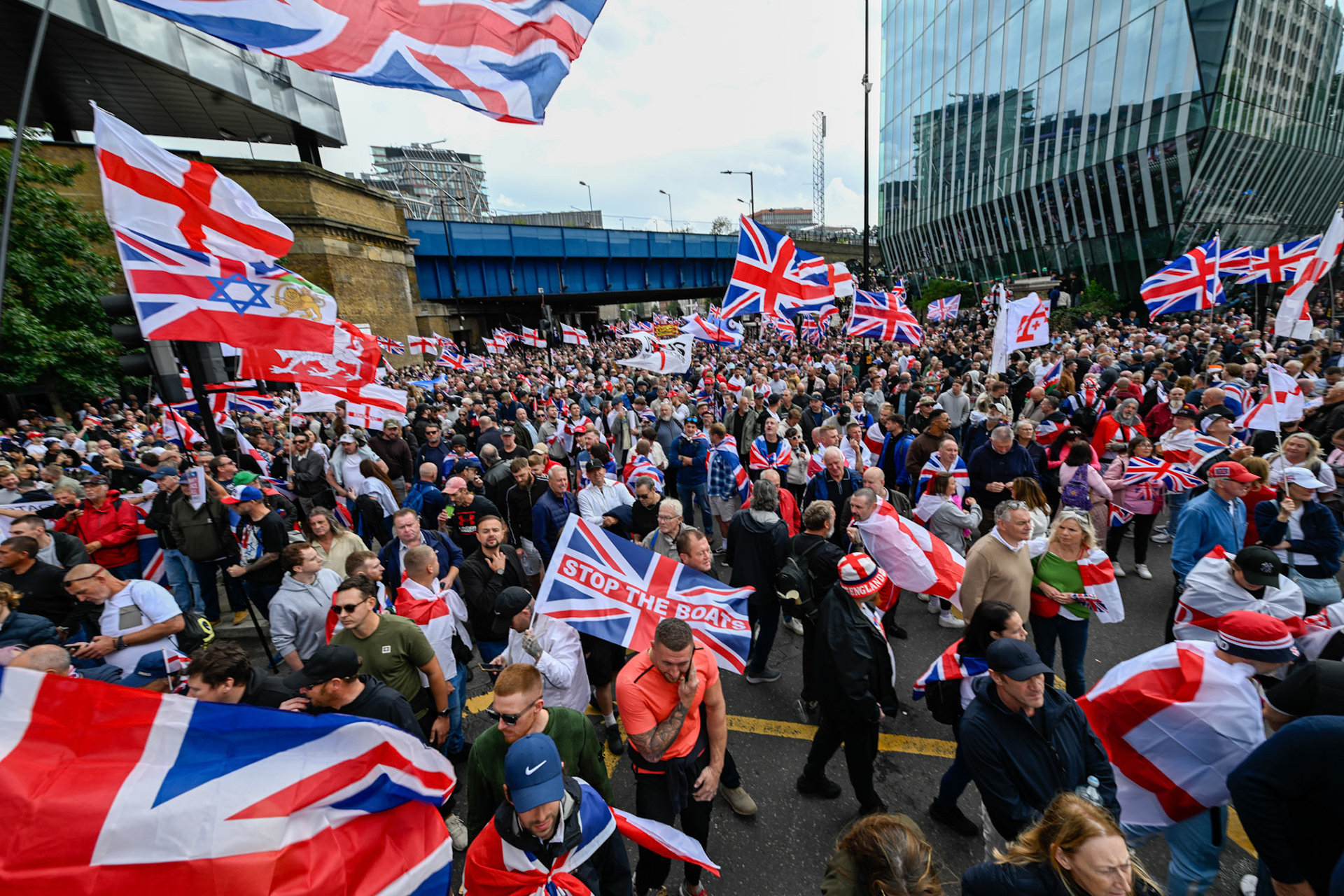 London, UK, 13th September: Approximately 100,000 supporters of Tommy Robinson march through central London,  monkeybutlerimages/alamy live news
