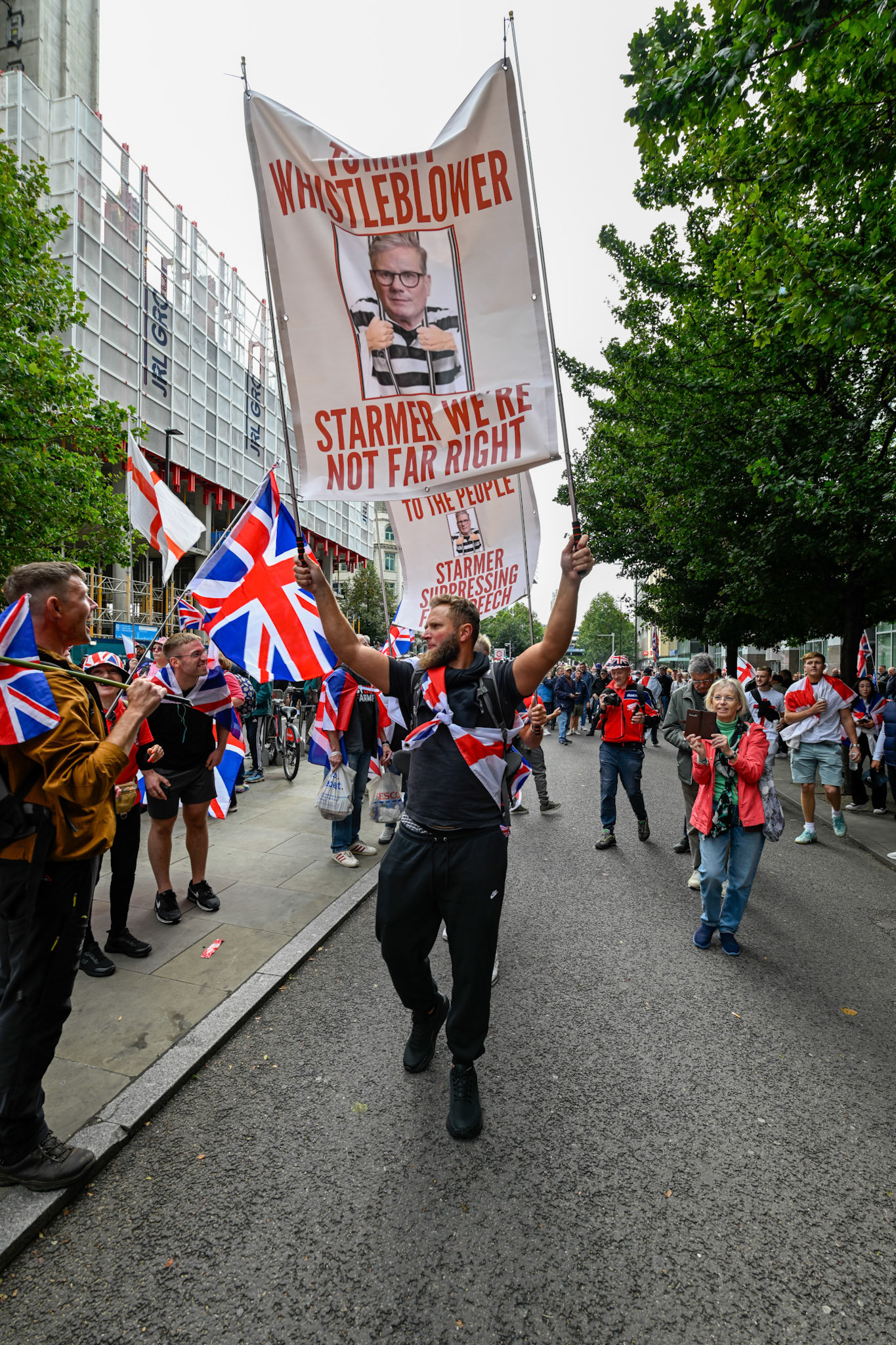 London, UK, 13th September: Approximately 100,000 supporters of Tommy Robinson march through central London,  monkeybutlerimages/alamy live news