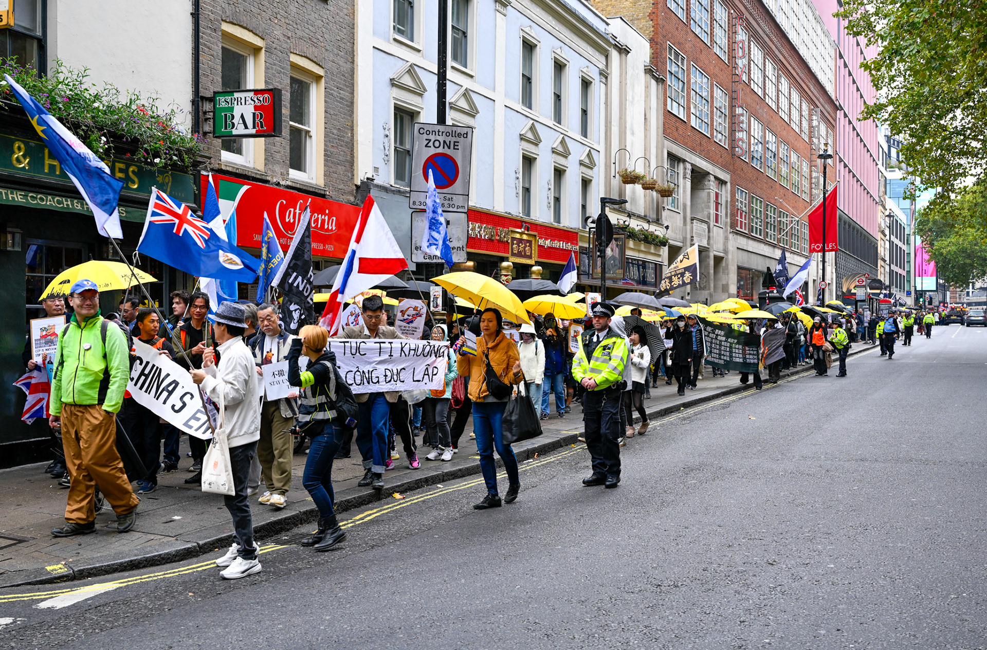 London, UK, 28th September 2025: 11th Anniversary march to commerate the pro democracy protest in Hong Kong in 2014 called the yellow umbrella revolution, monkeybutlerimages/ alamy live news