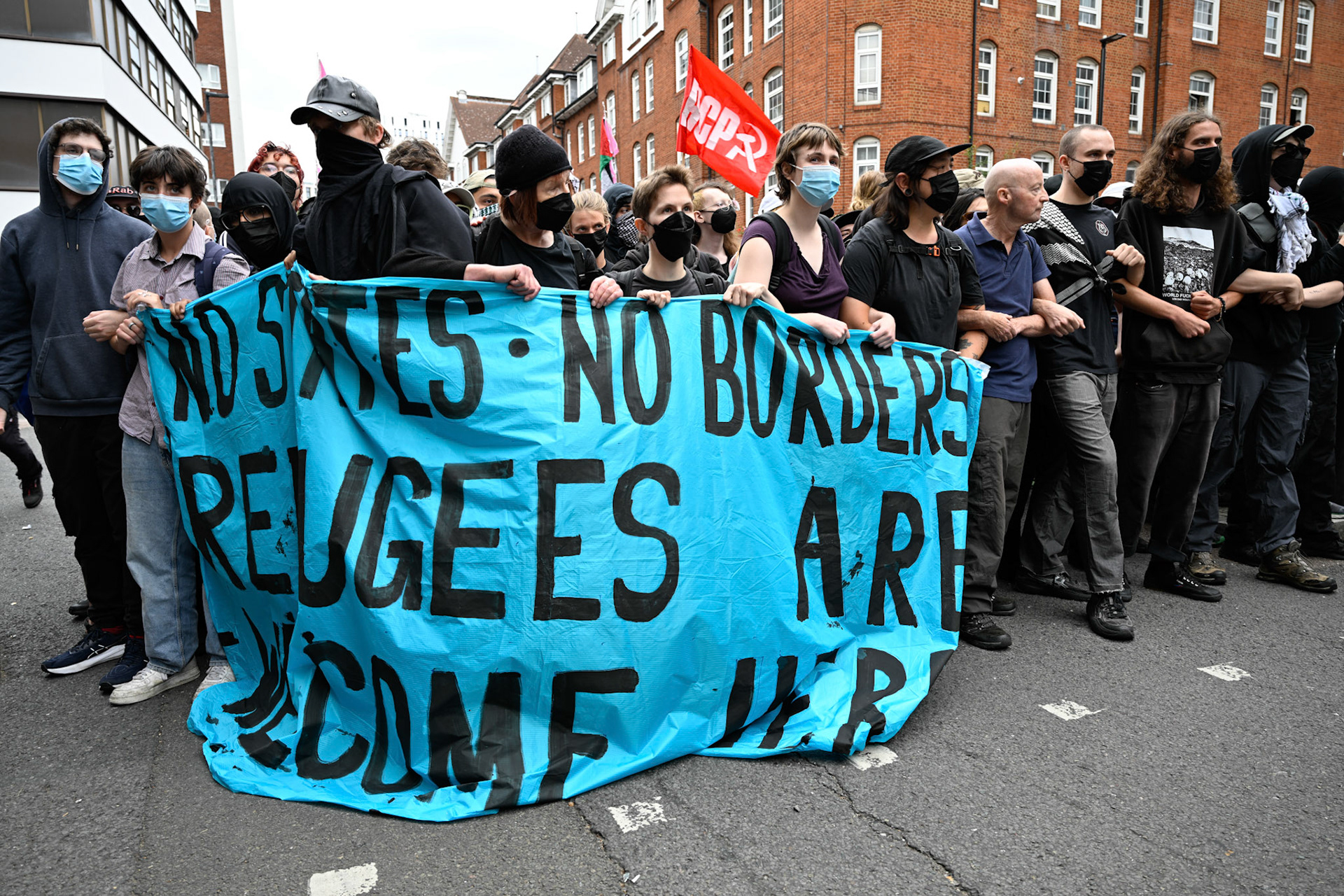 London, UK, 2nd August 2025, Protest outisde of the Thistle Hotel Barbican supporting migrant residents and challenging a counter protest