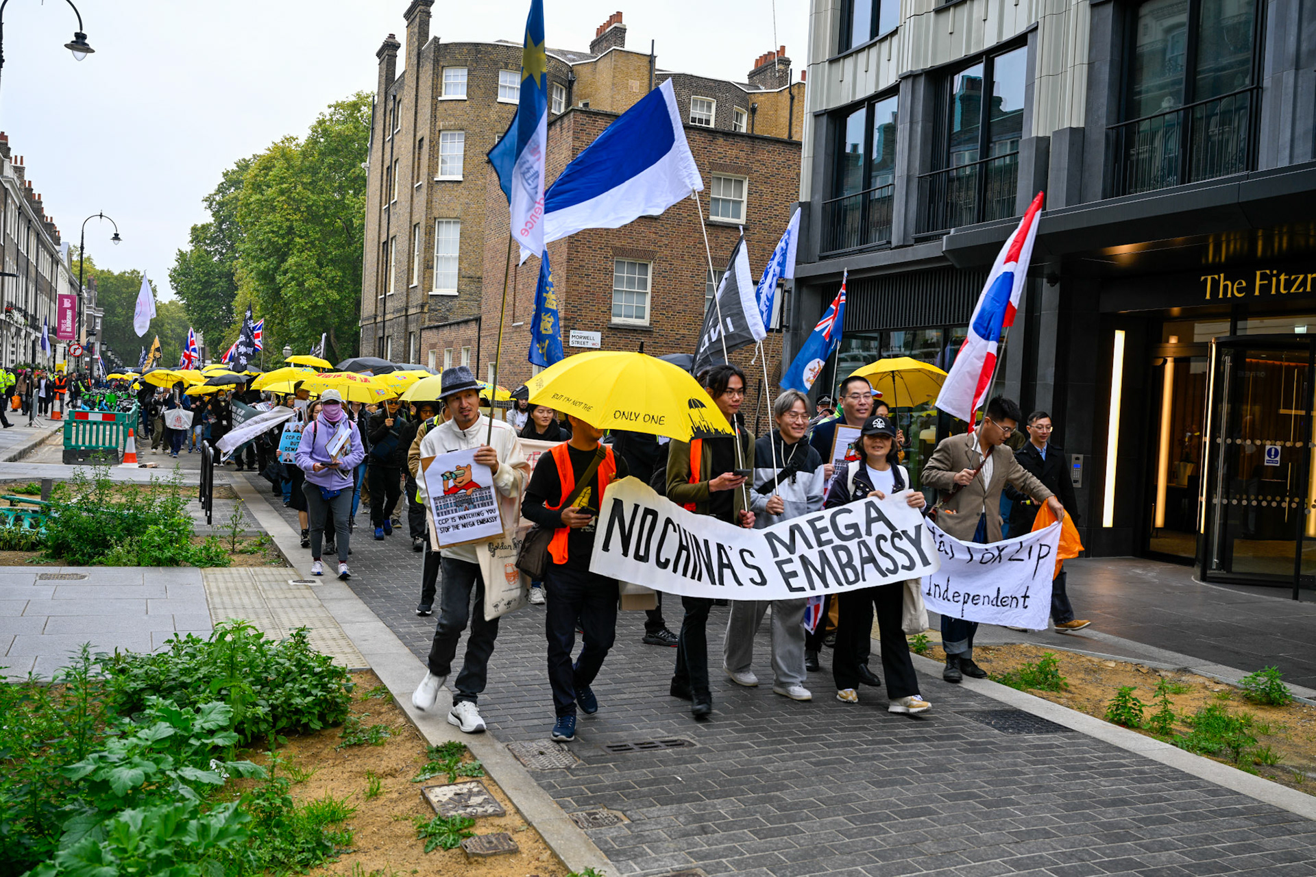 London, UK, 28th September 2025: 11th Anniversary march to commerate the pro democracy protest in Hong Kong in 2014 called the yellow umbrella revolution, monkeybutlerimages/ alamy live news