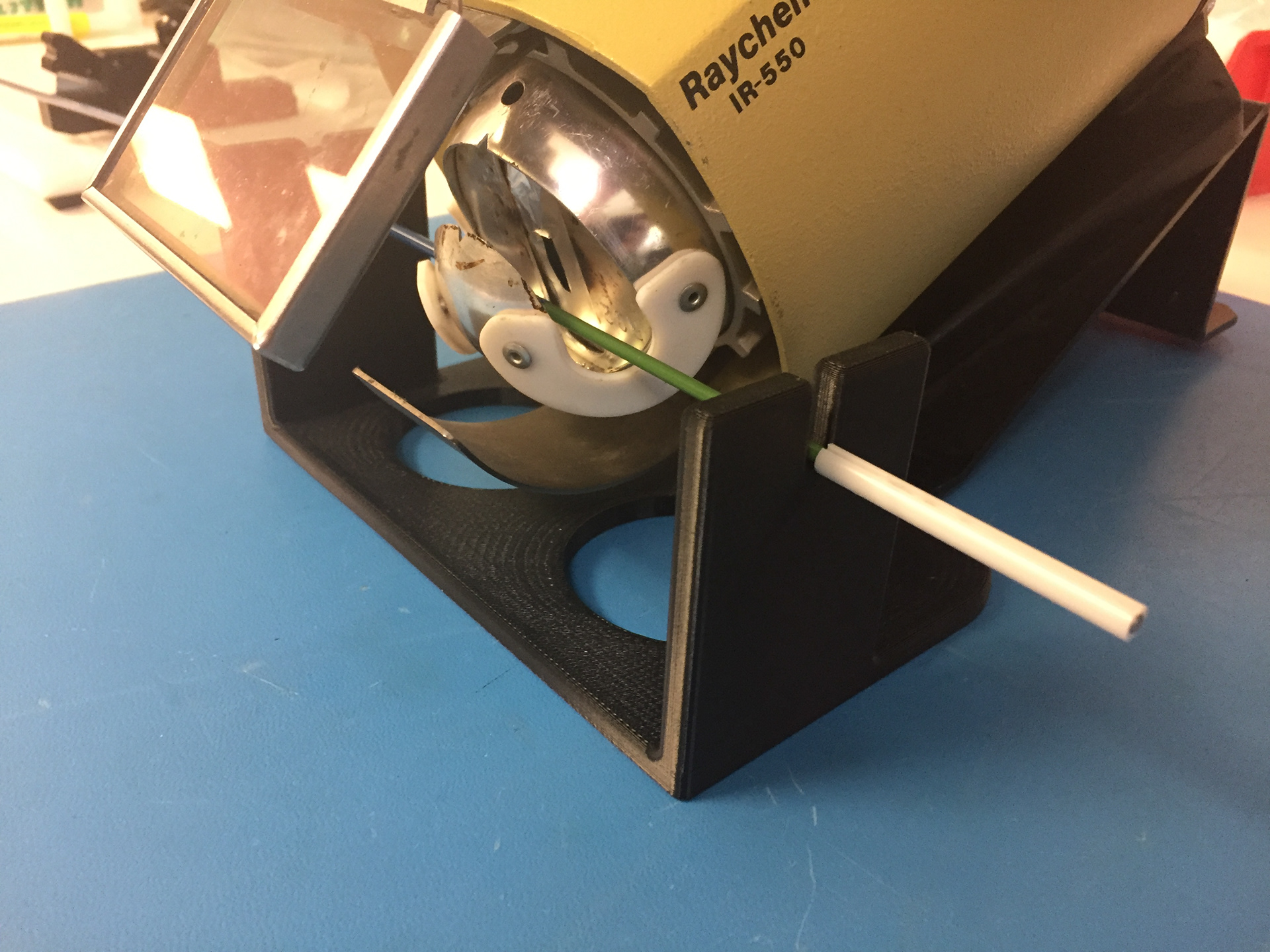 Simple yet effective holder to secure solder sleeve to a catheter.