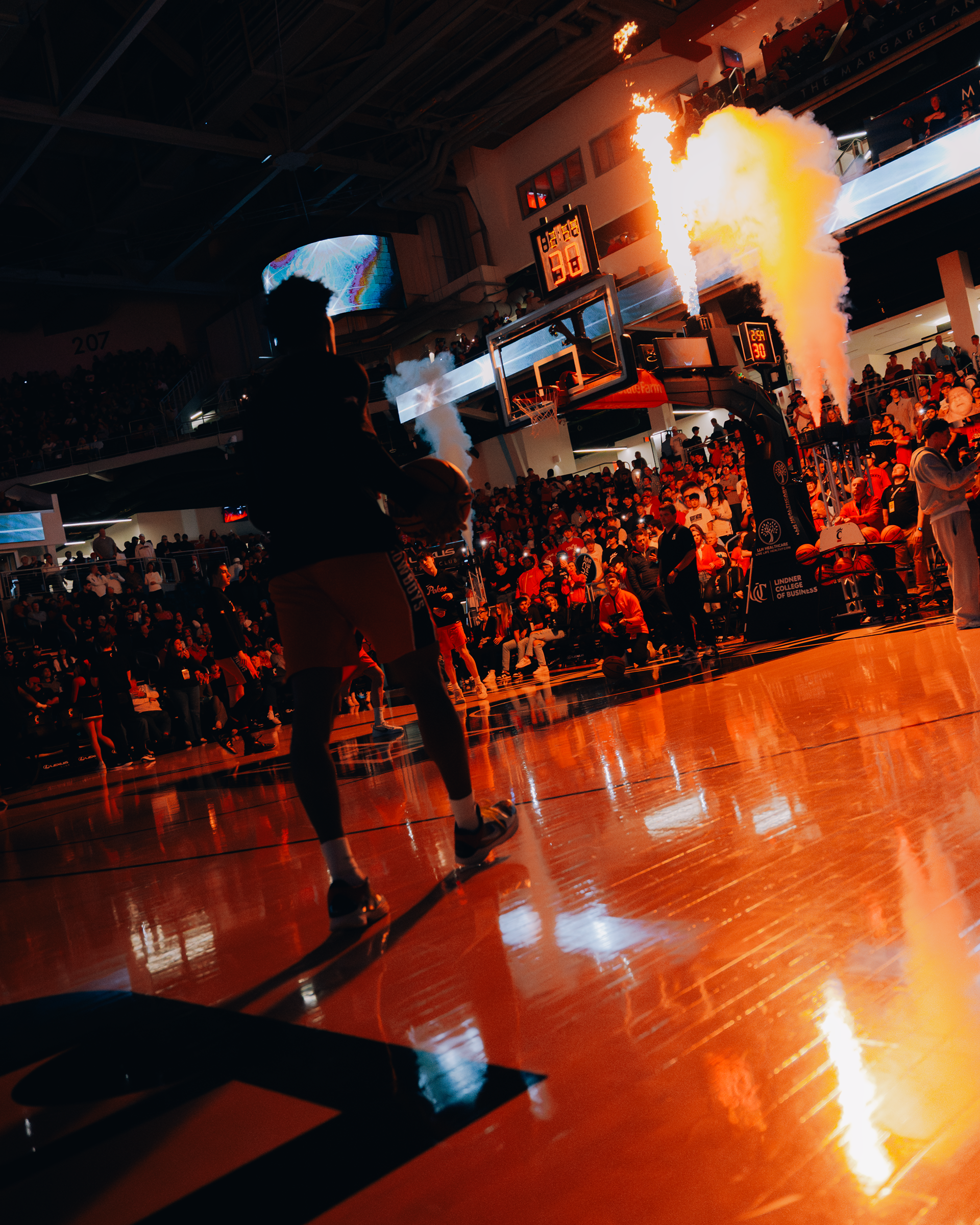 Anthony Roy ready to start layup lines pregame with pyro in the foreground.