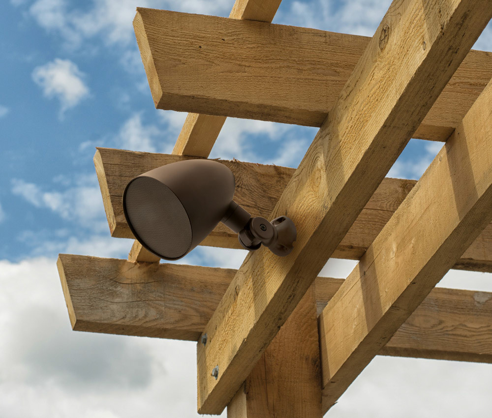 Closeup shot at the corner of a wooden pergola against blue sky background
