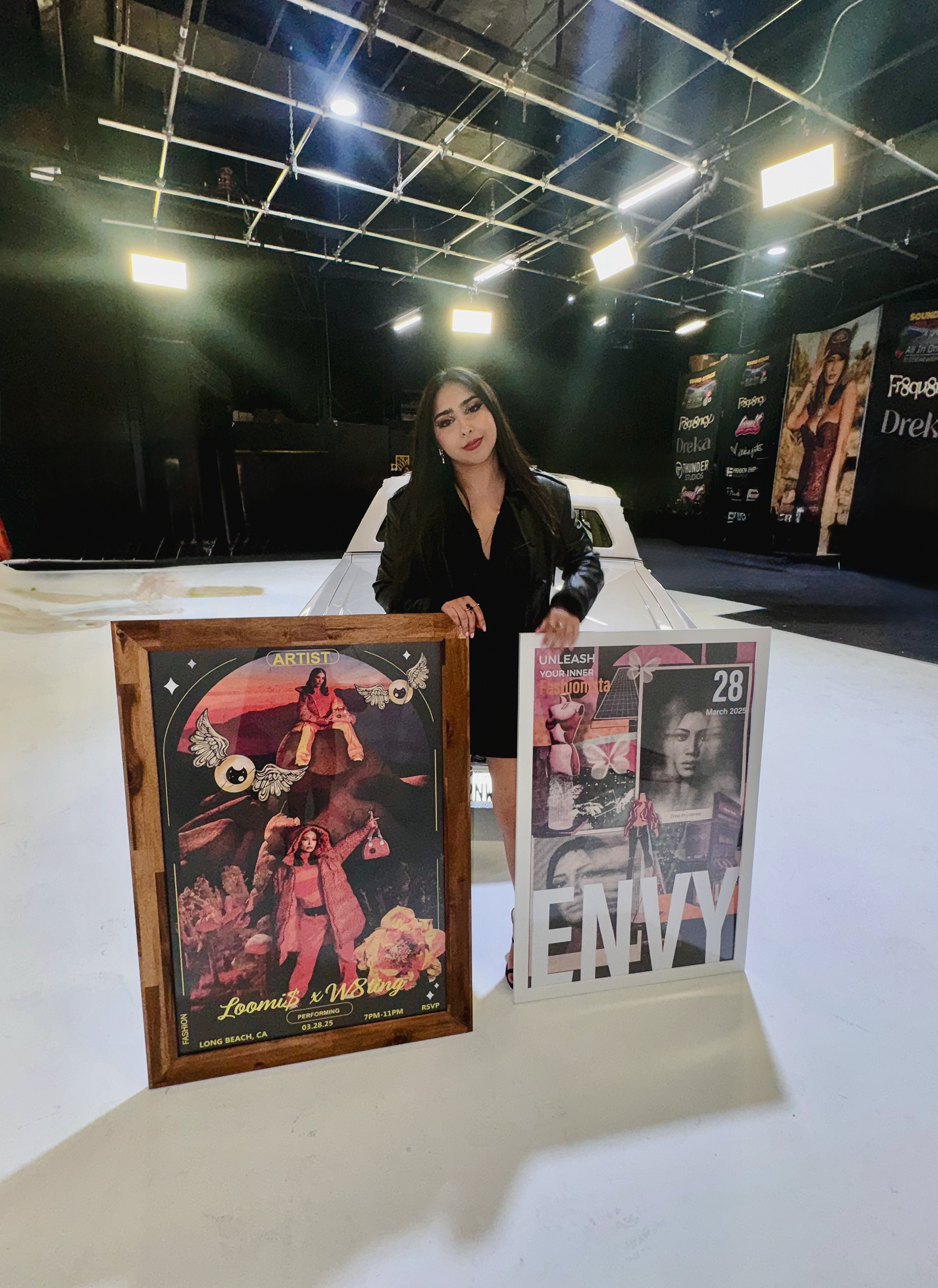 Picture of myself with both designs I created for LB Fashionweek show