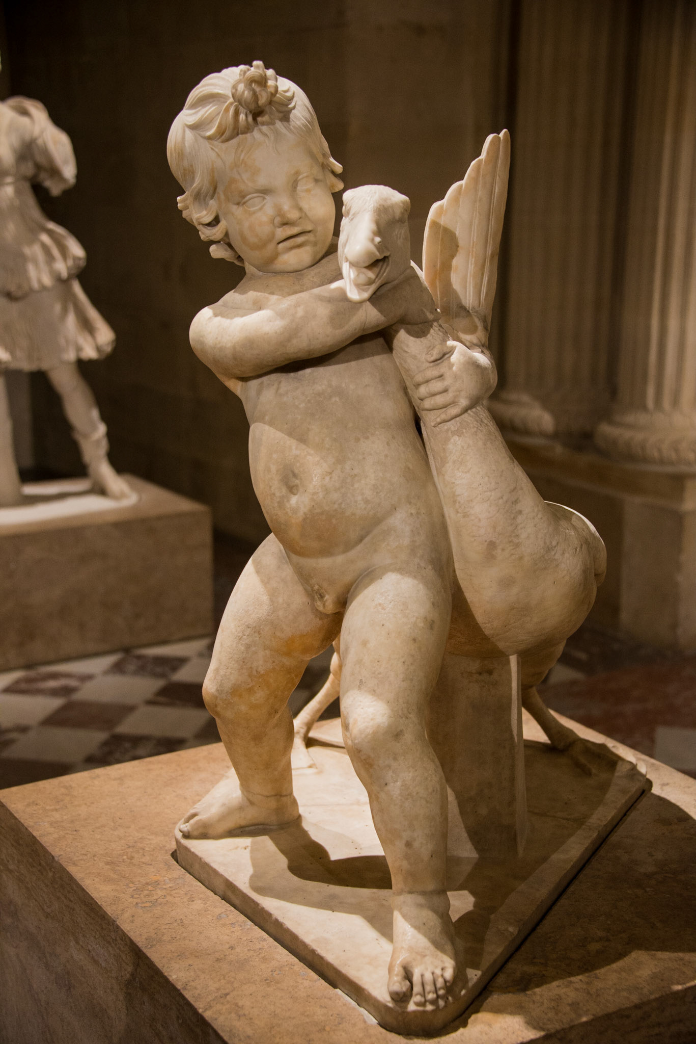 Child and Goose Sculpture at The Louvre