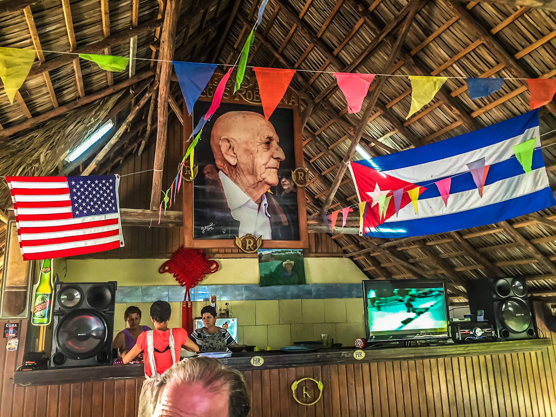 Alejandro Robaina Portrait along with American and Cuban Flags