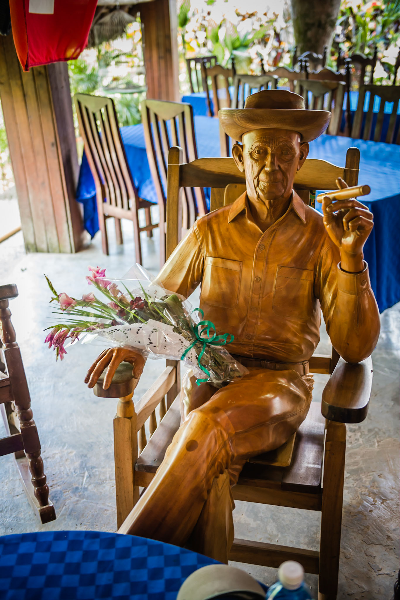 Alejandro in all his glory, fresh flowers and cigar.