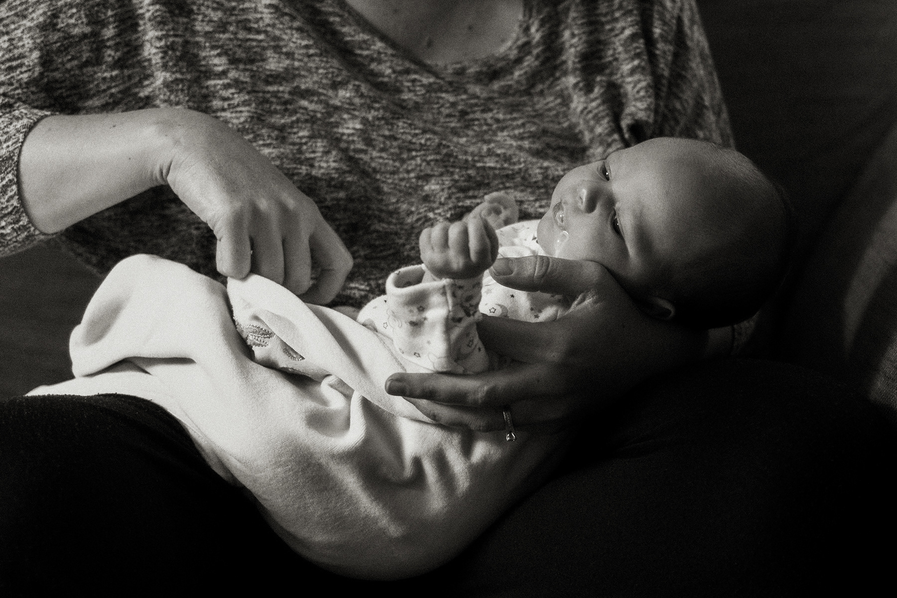 close up ofmilk dribbling out of baby's mouth