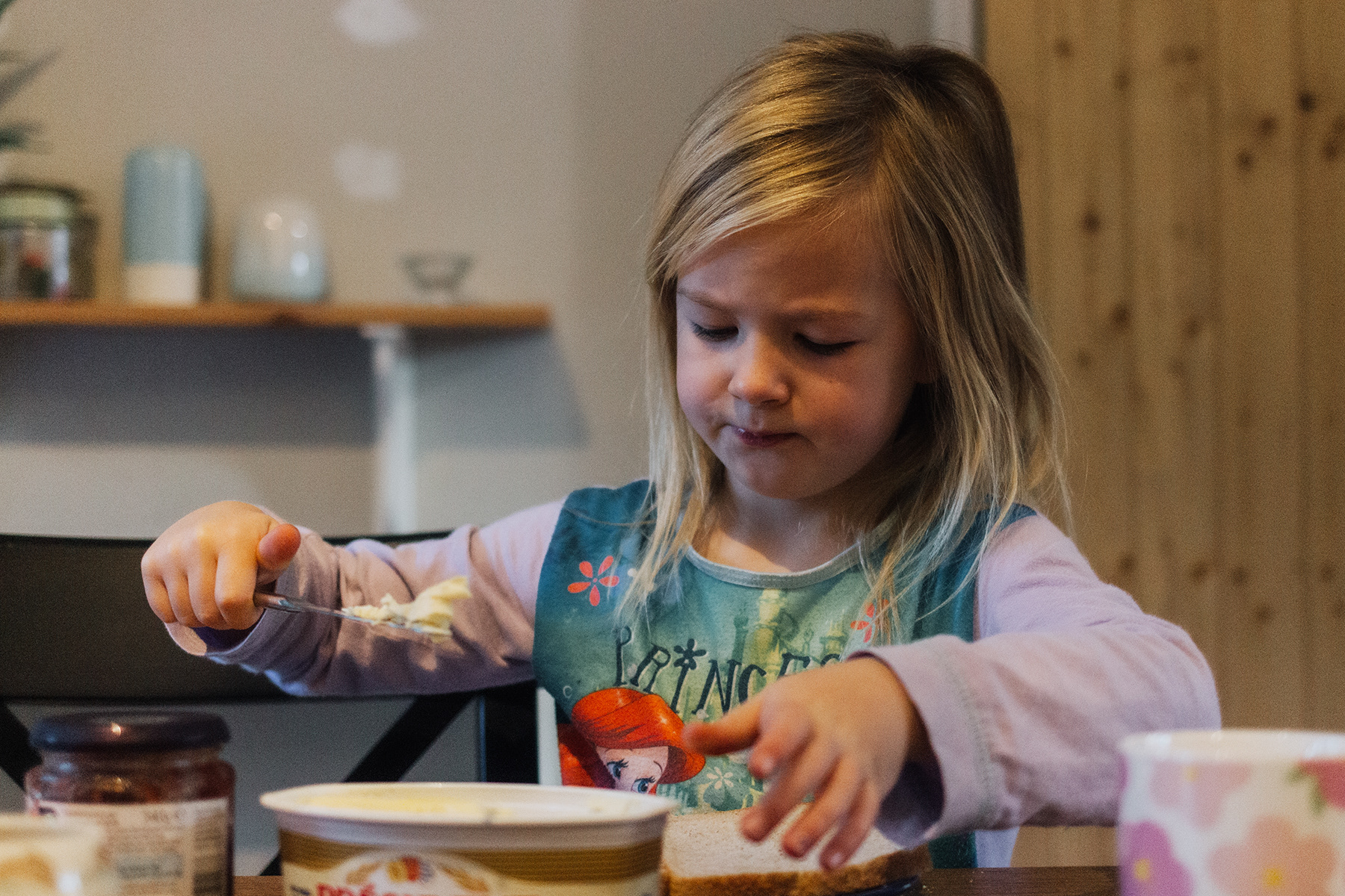 girl buttering her bread