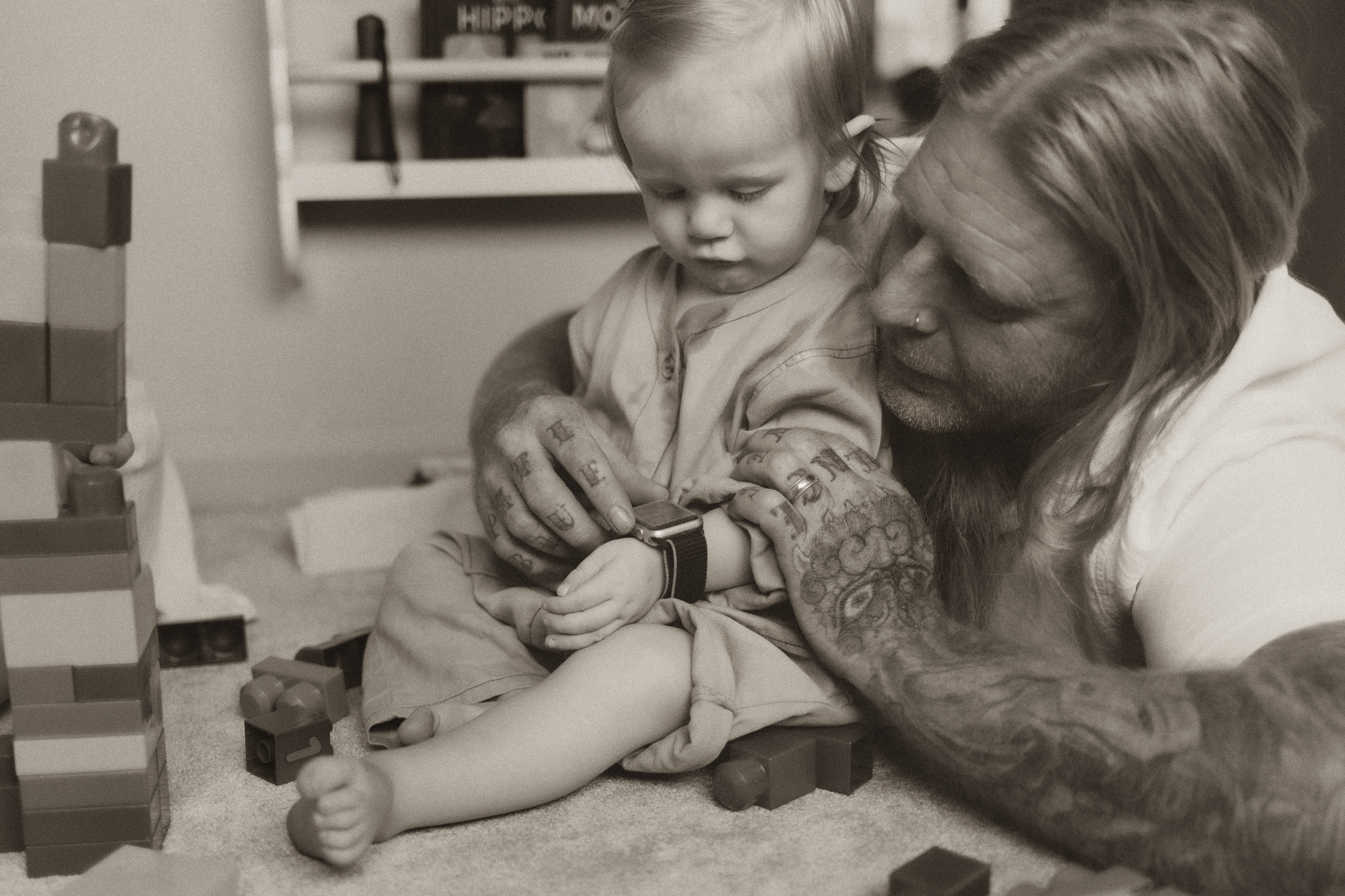 dad putting watch on little boy's arm