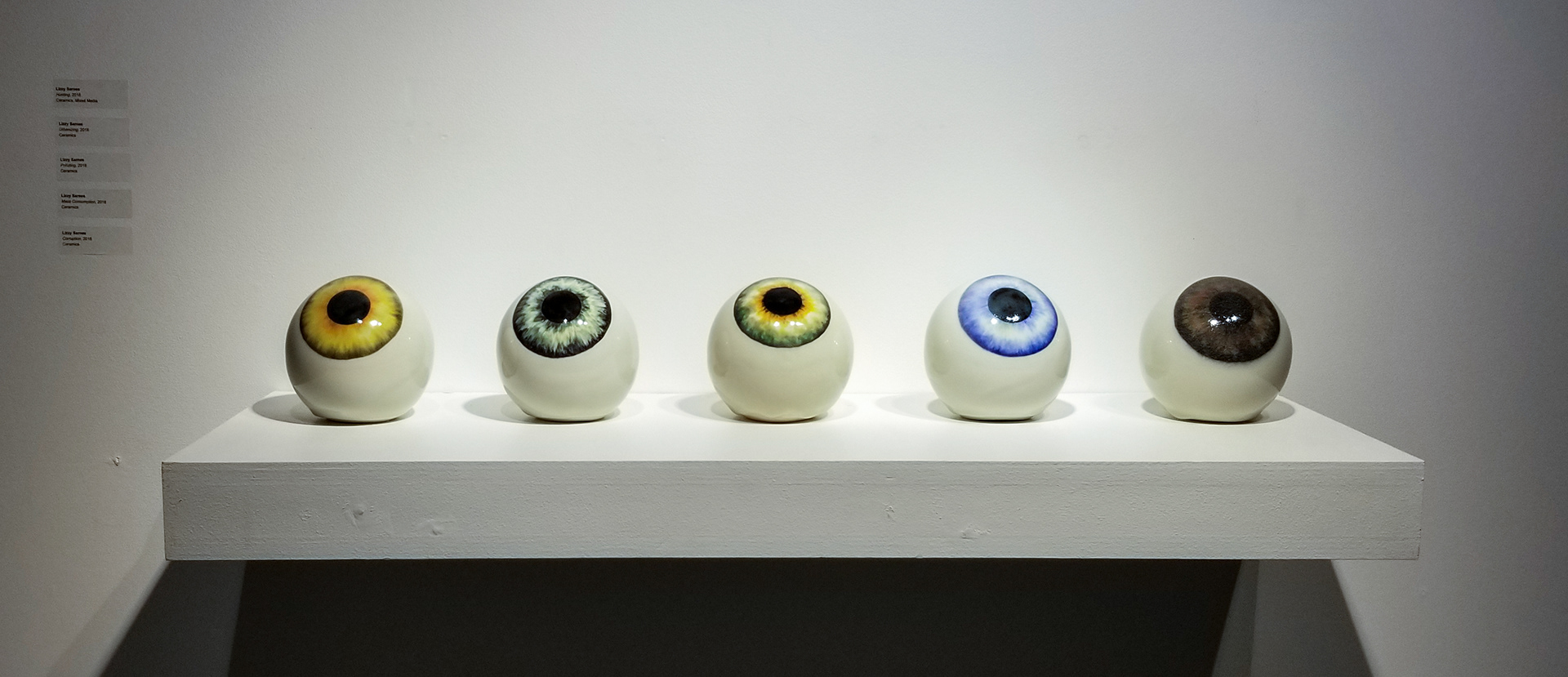 From left to right: "Hunting," ceramics. "Urbanization," ceramics. "Pollution," ceramics. "Mass Consumption," ceramics. "Corruption," ceramics.