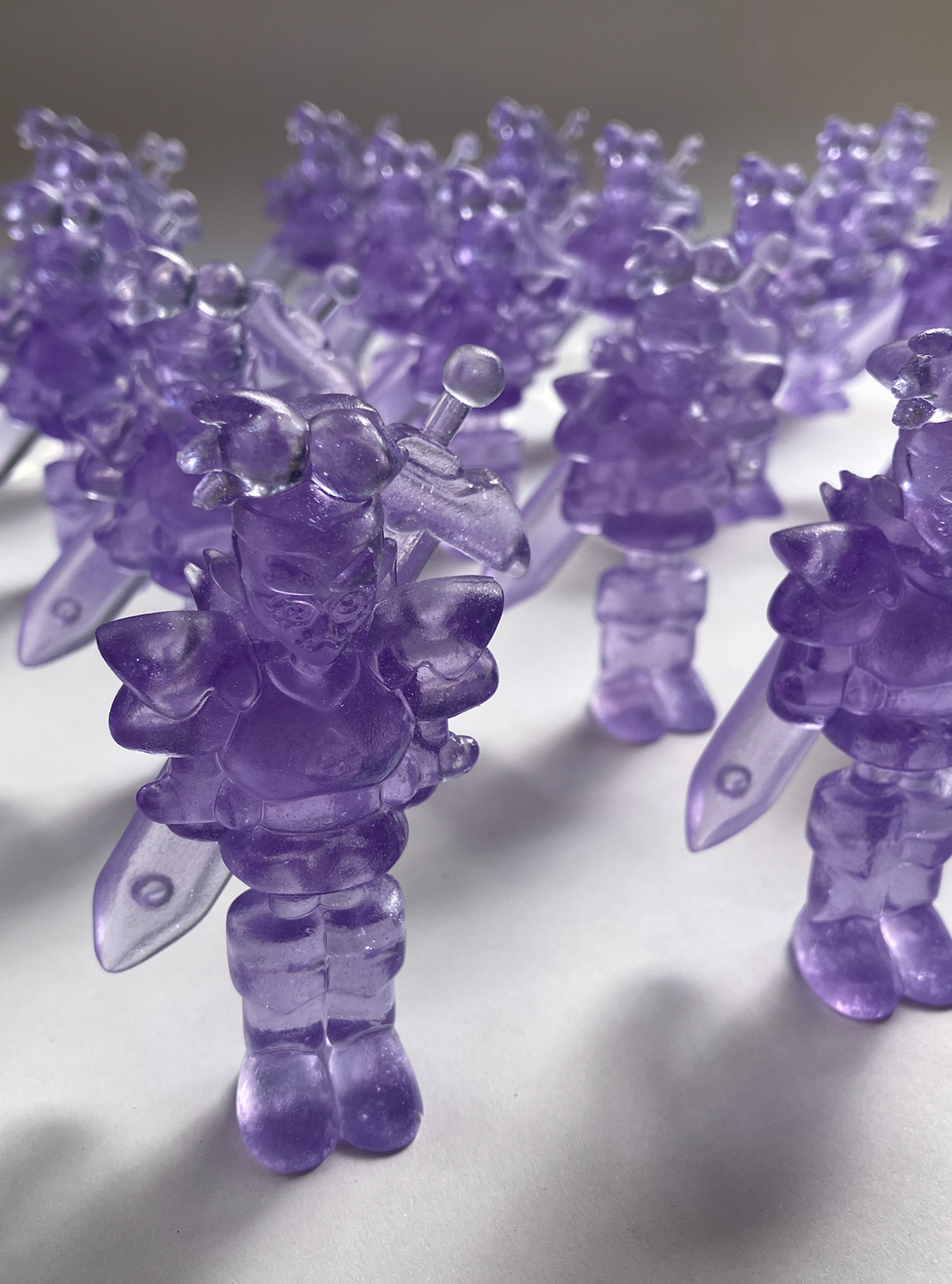 I 3D modeled him and the sword, made several silicone molds of both, and resin cast all 90 pieces.