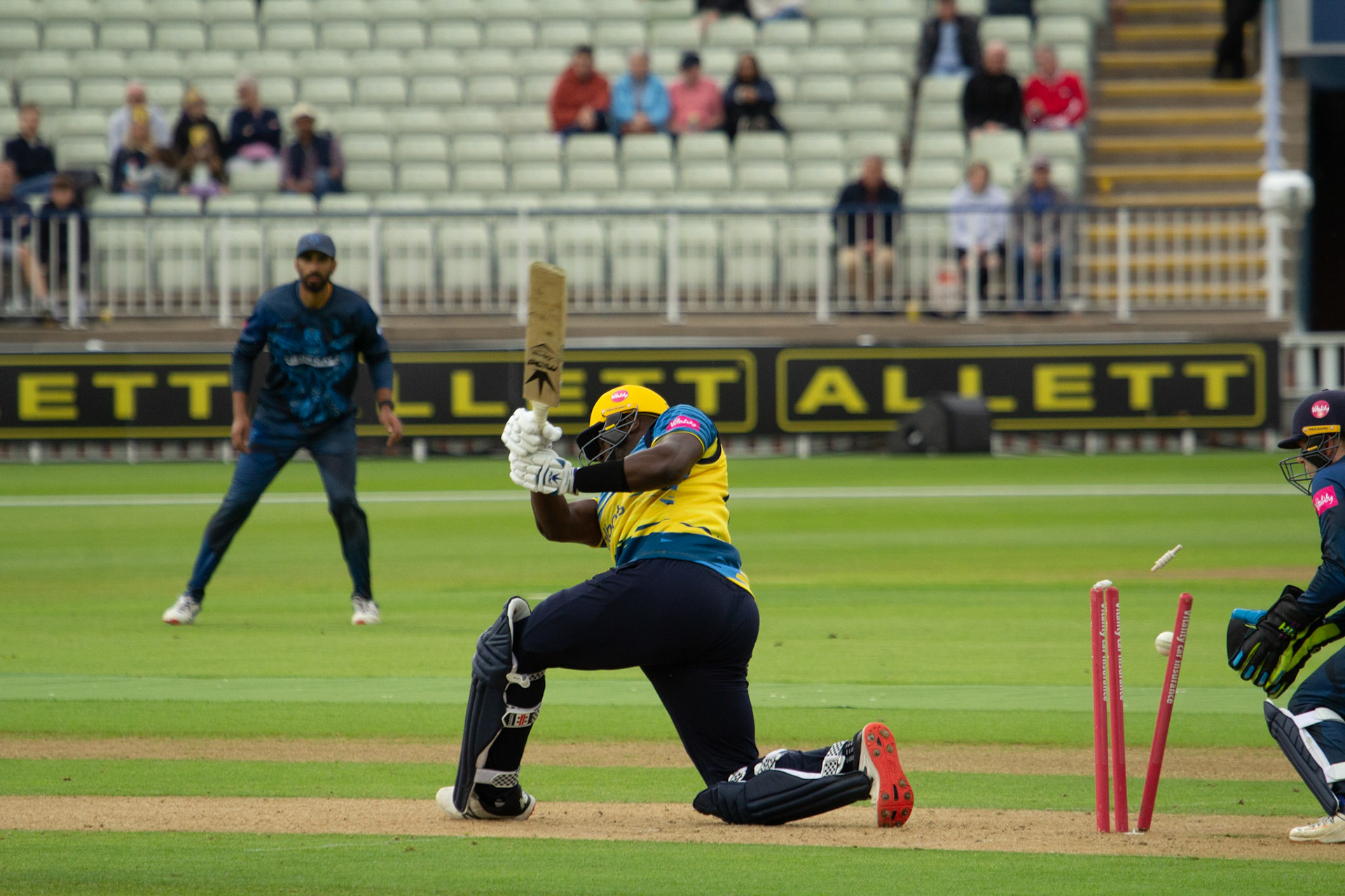 Carlos Brathwaite is bowled attempting a sweep