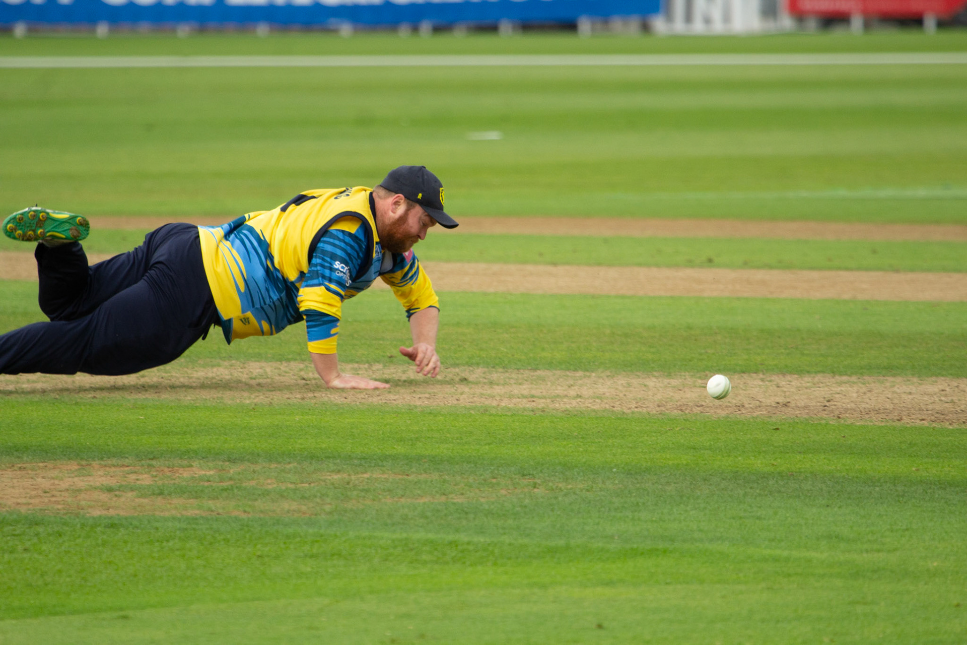 Paul Stirling dives on the square to stop the ball 