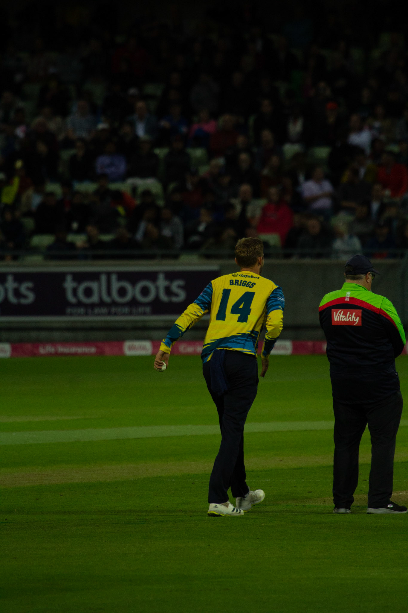 Briggs walking in to bowl