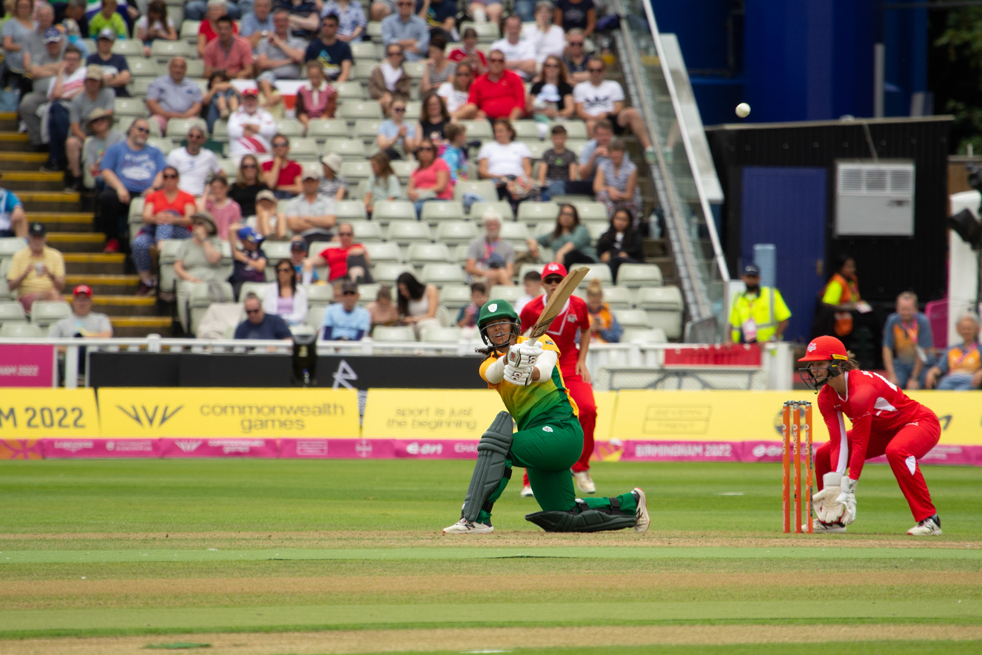 Chloe Tryon slog-sweeps over square leg