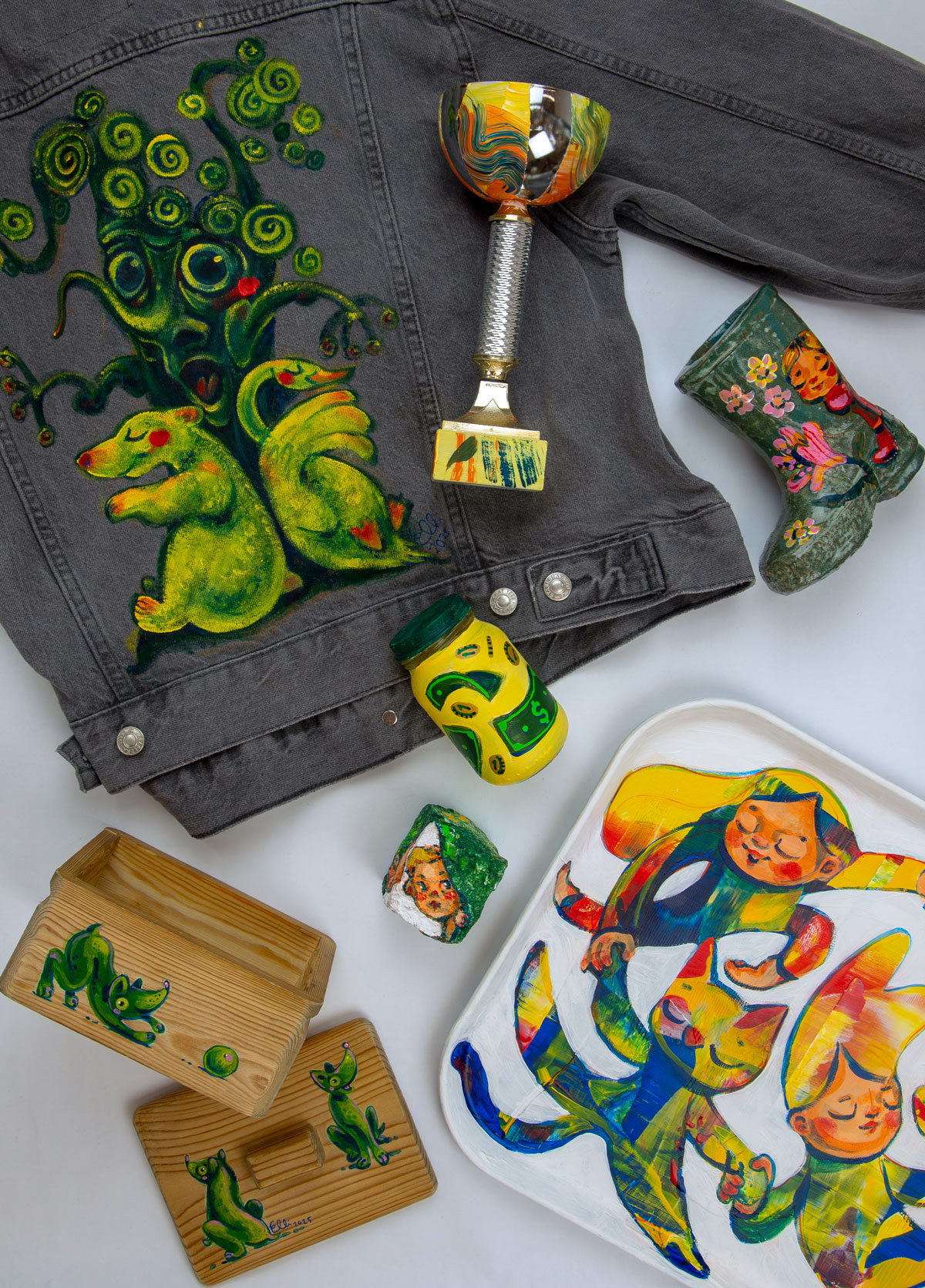 Upcycled objects like denim jacket and trays transformed into art by Elli Maanpää.