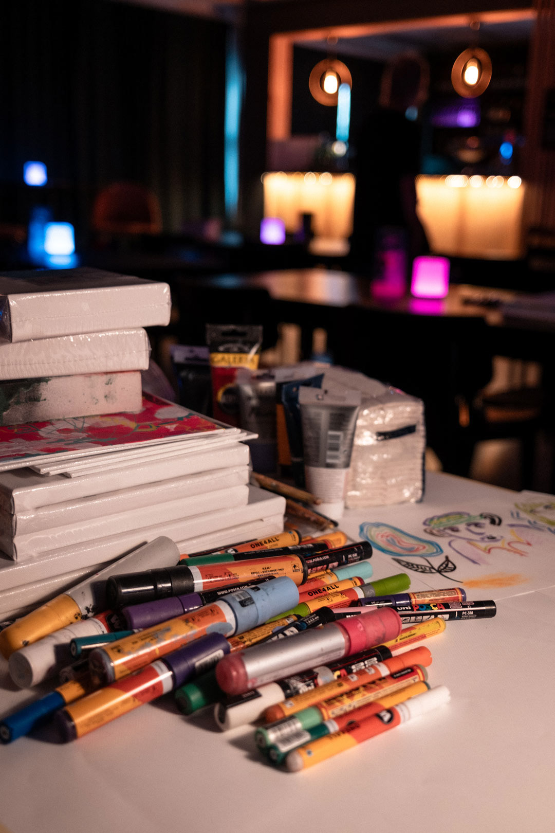 An array of art supplies ready for creativity at the Jazz & Draw event. Captured by Jani Lappalainen.