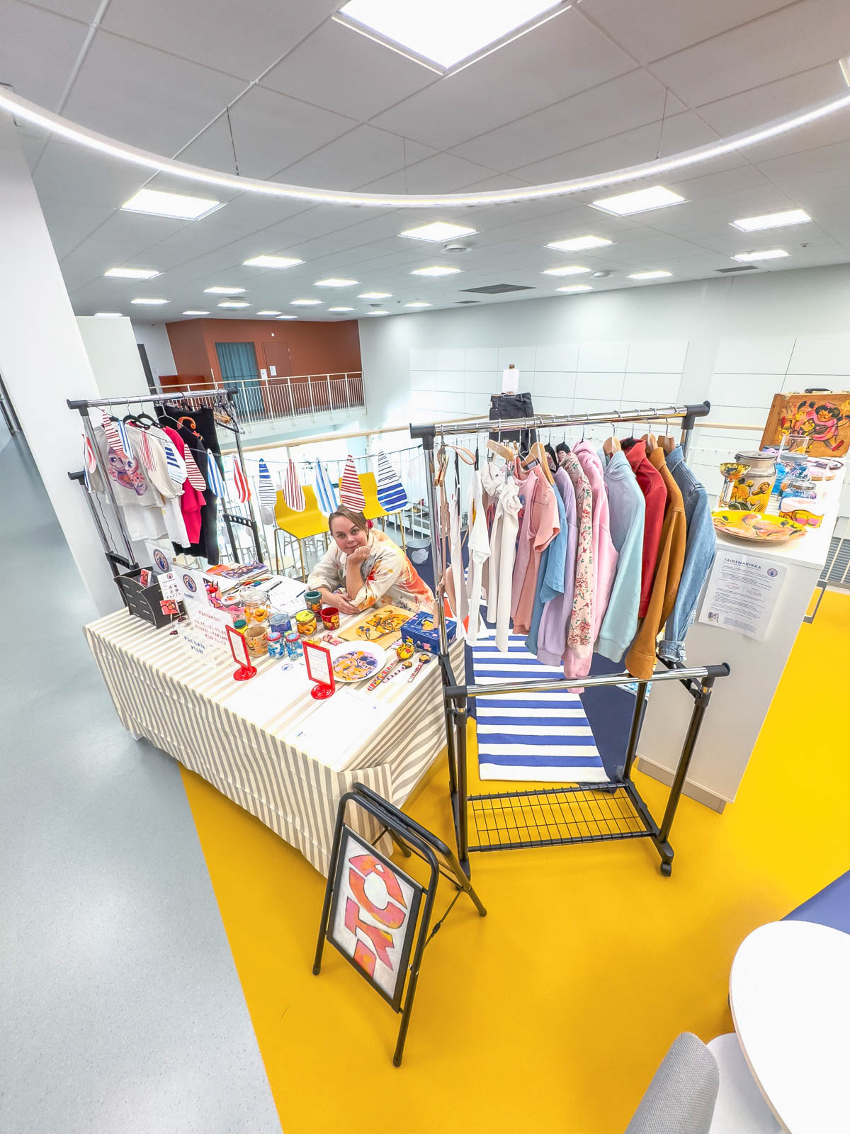 Artist Elli Maanpää at the Taidenarikka (Art Cloakroom) installation, Valkeavuori Campus, Kaarina. Photograph by Jan-Erik Andersson.