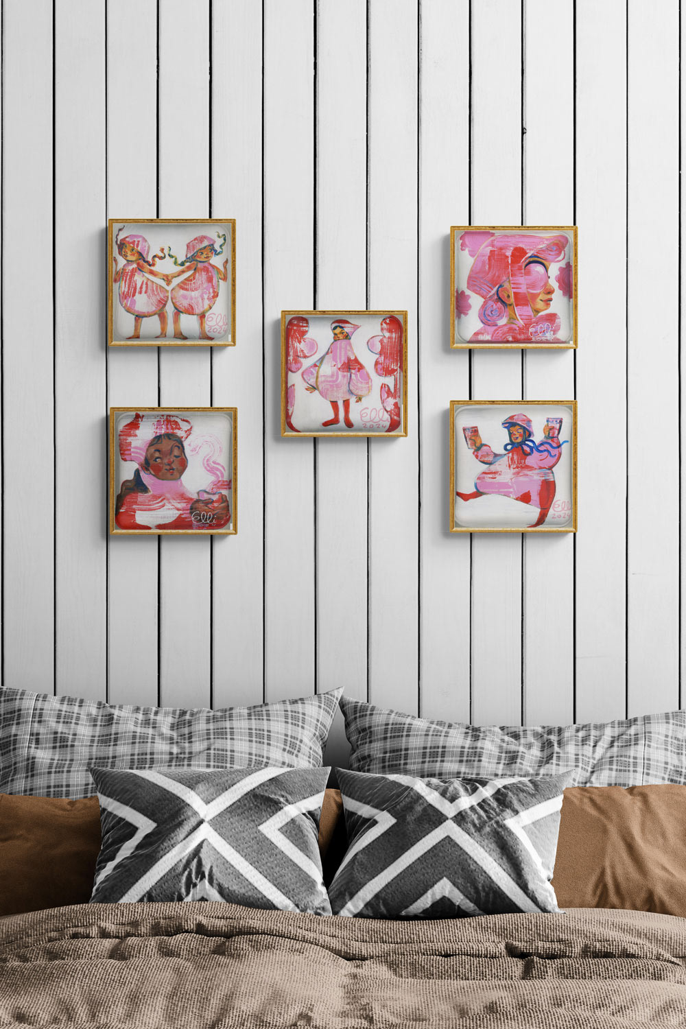 Five red and pink-toned paintings from Elli Maanpää's 'Muñeca' series displayed in a cozy bedroom. The doll-like figures add a playful yet warm touch to the decor.