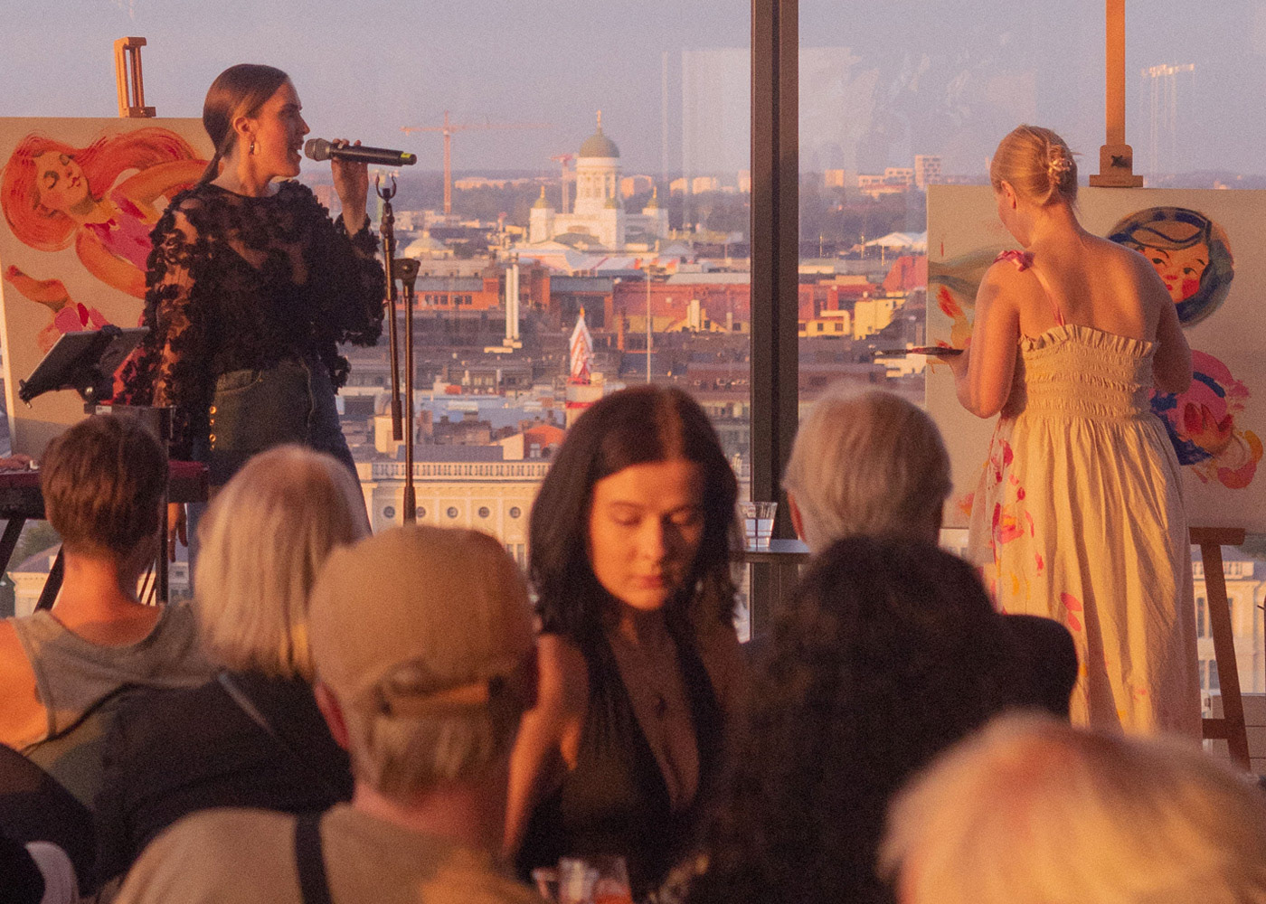 ART N' SOUL hosts global art events spotlighting emerging female artists. In Helsinki, visual artist Elli Maanpää created 'Power Lady' live while musician Malka performed.