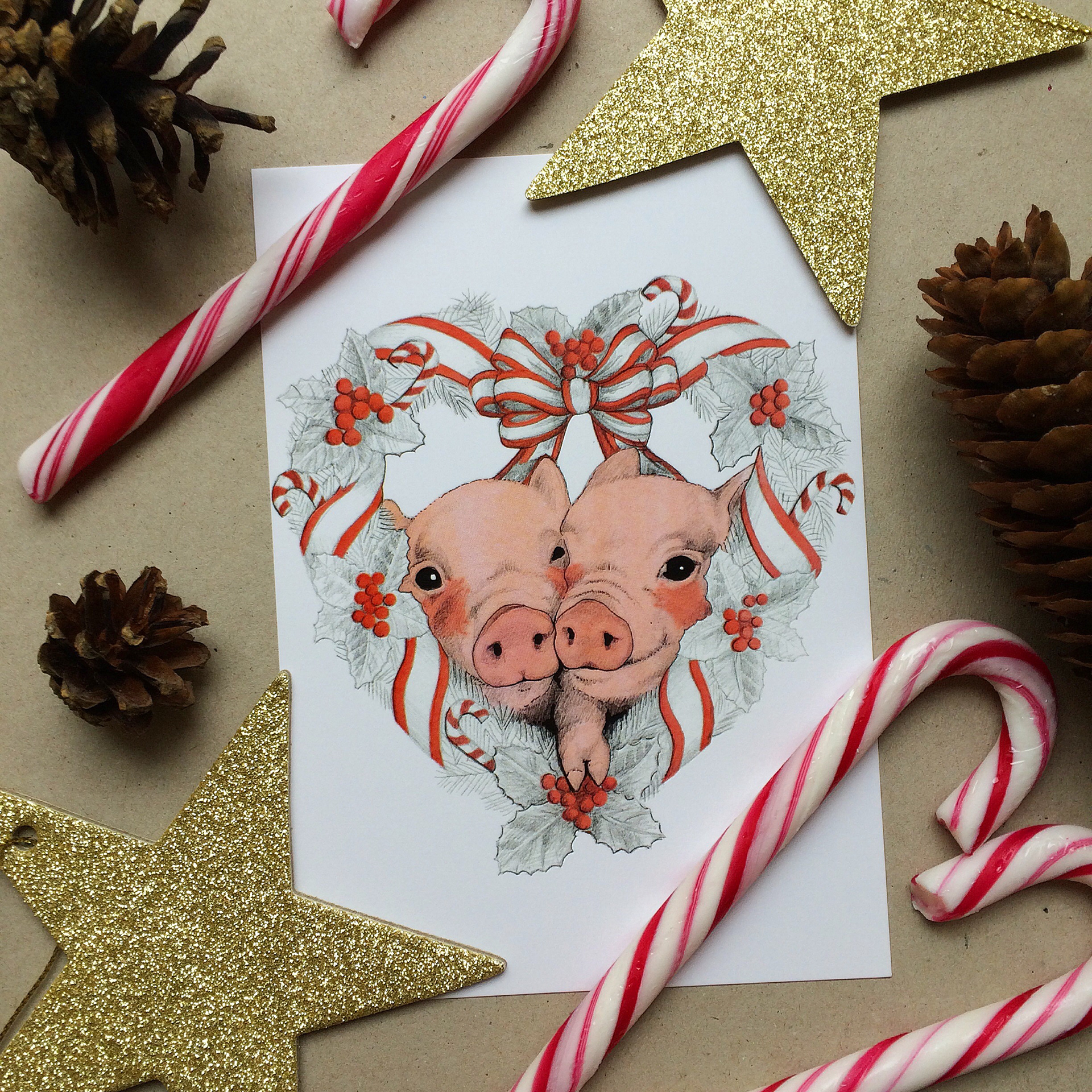Christmas postcards by Finnish artist Elli Maanpää for Paletti's artist-feature collection. Cute hand drawn piglets inside a heart shaped christmas wreath.