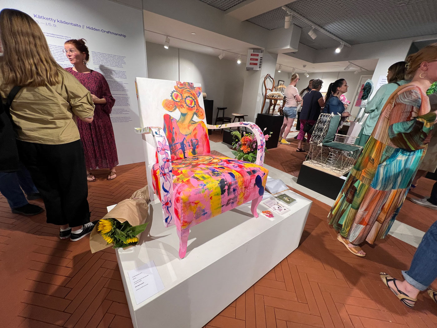 Elli Maanpää's painted armchair featured in the Hidden Craftsmanship exhibition at Kämp Gallery in Helsinki transforms a classic 'grandma' chair into a throne.