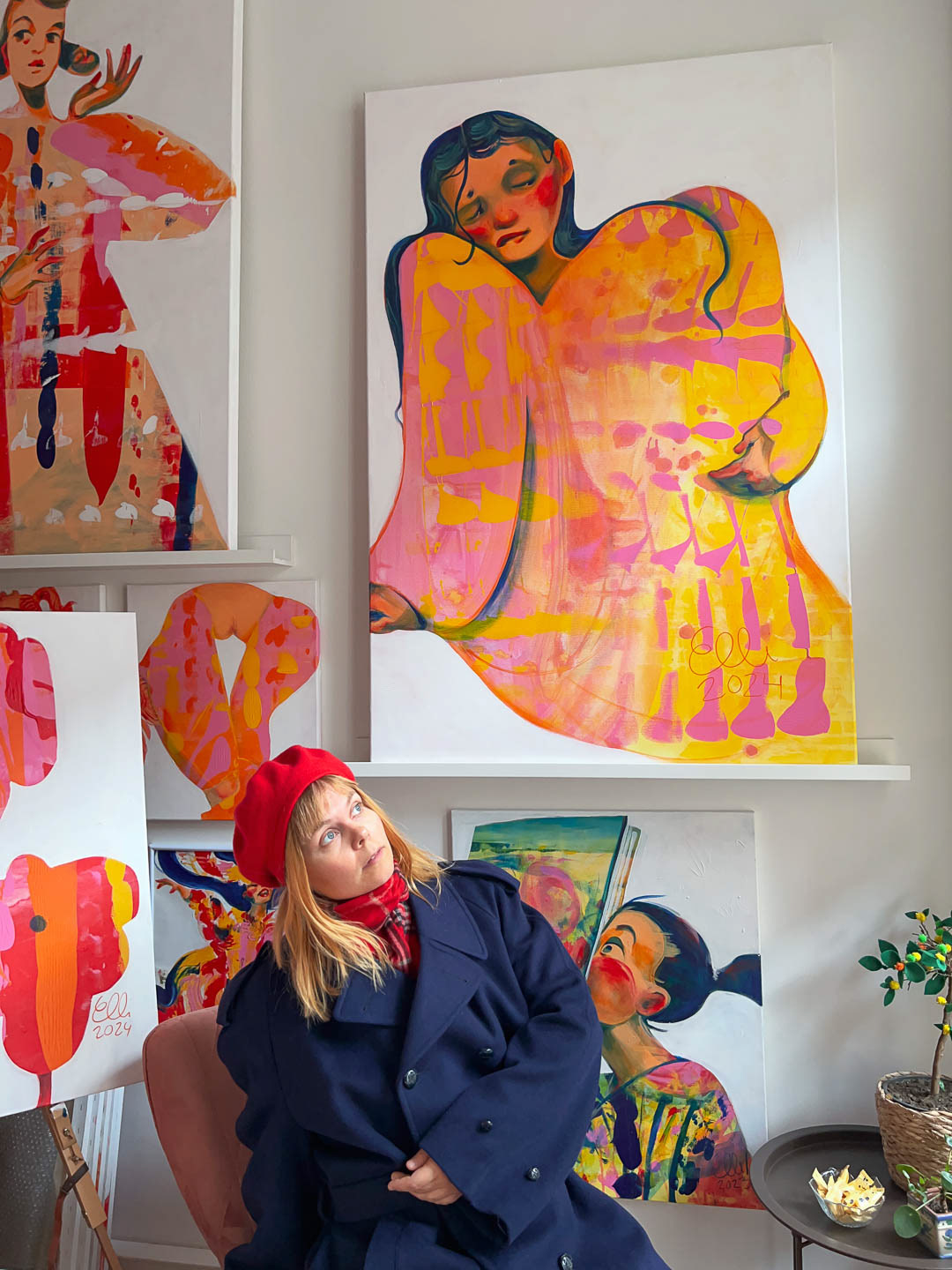 Elli Maanpää contemplating with her painting ‘Lemon Jelly Melancholy’ in her Helsinki studio.