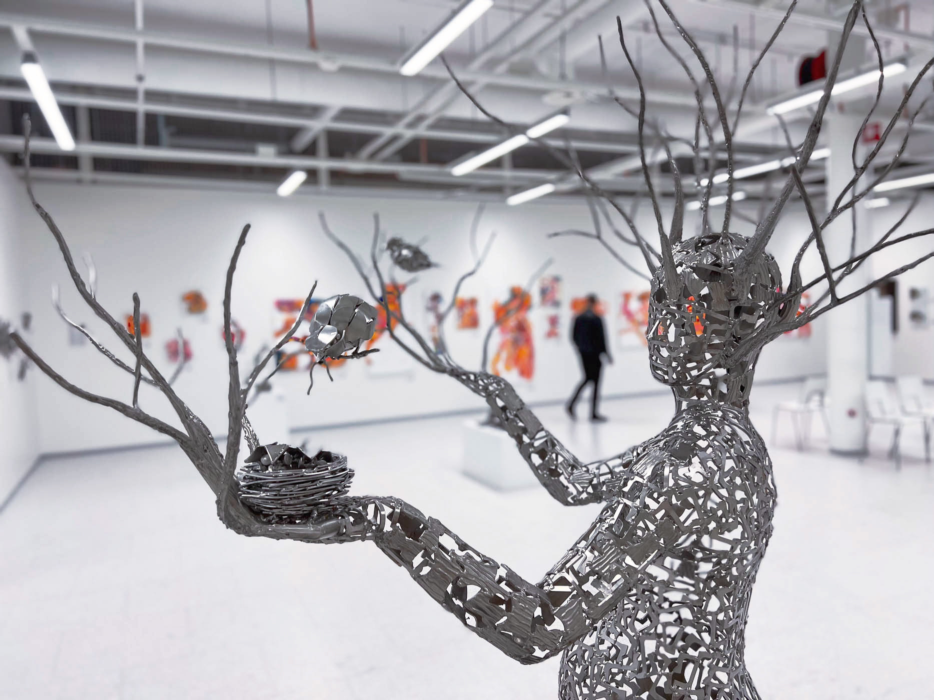 Seven talented Finnish female artists, with Suvi Nurmi's metal sculpture in the foreground.